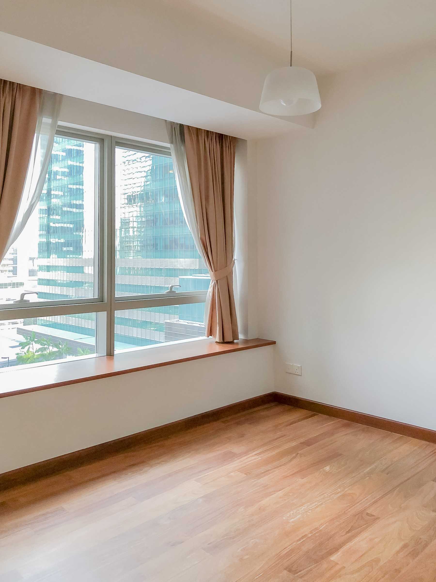 Minimalist Bedroom with Parquet Floor and Paintings