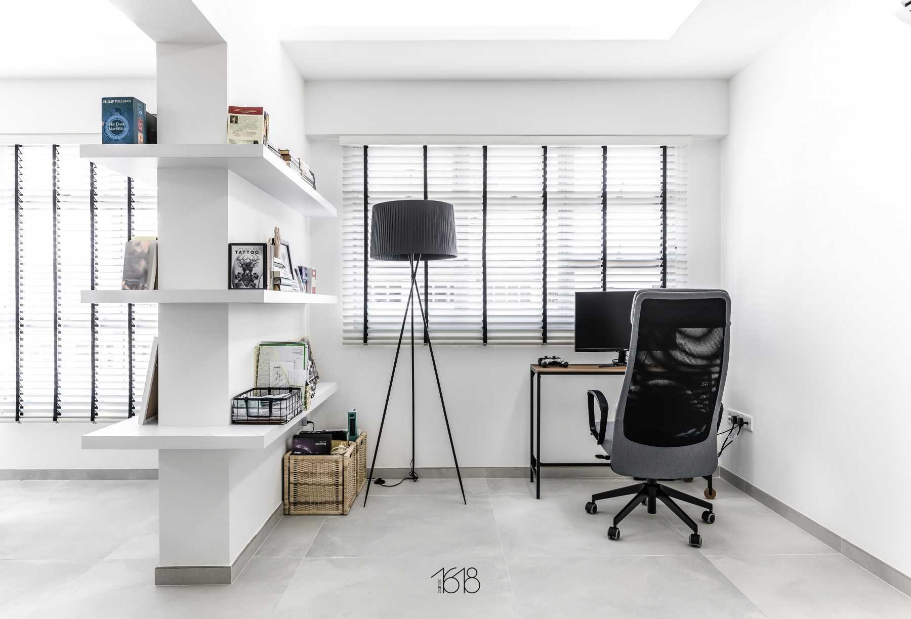 Minimalist Study with Bookshelf and Homogeneous Tiles