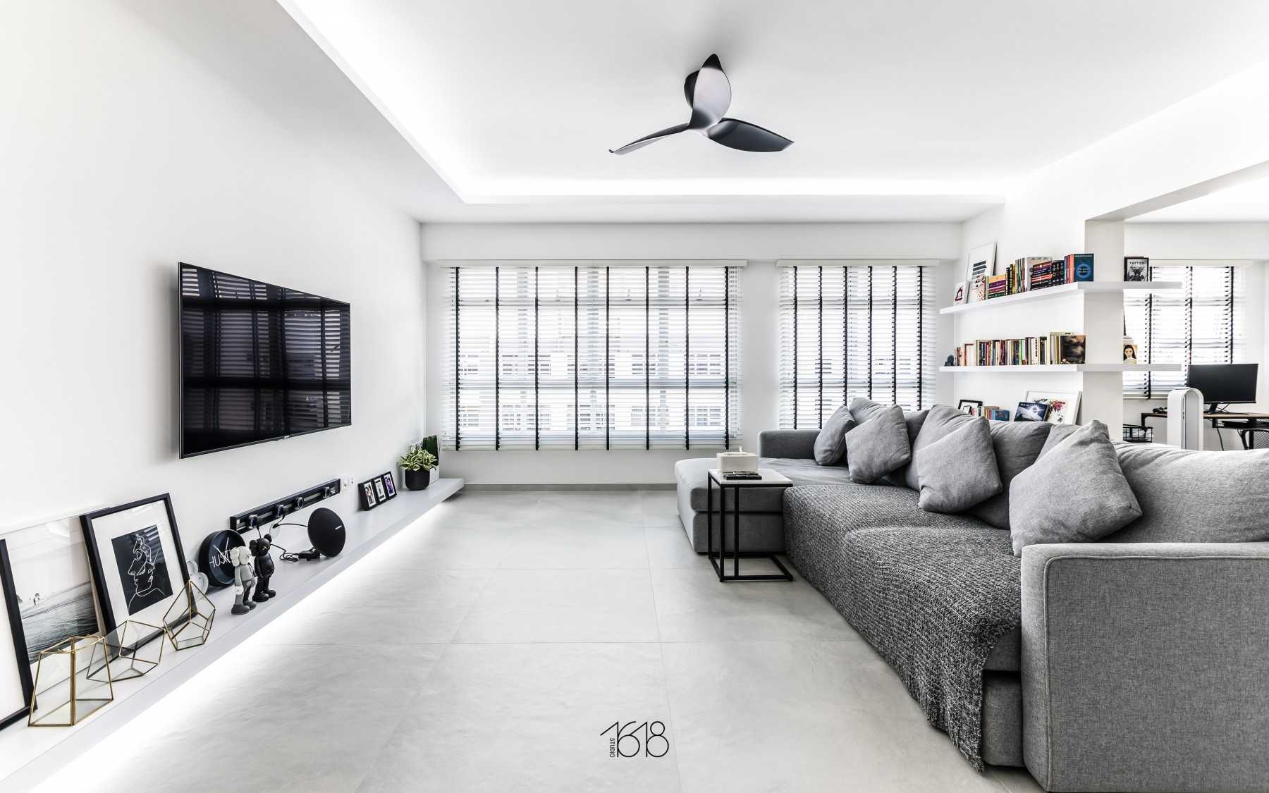 Minimalist Living Room with Homogeneous Tiles and TV Console
