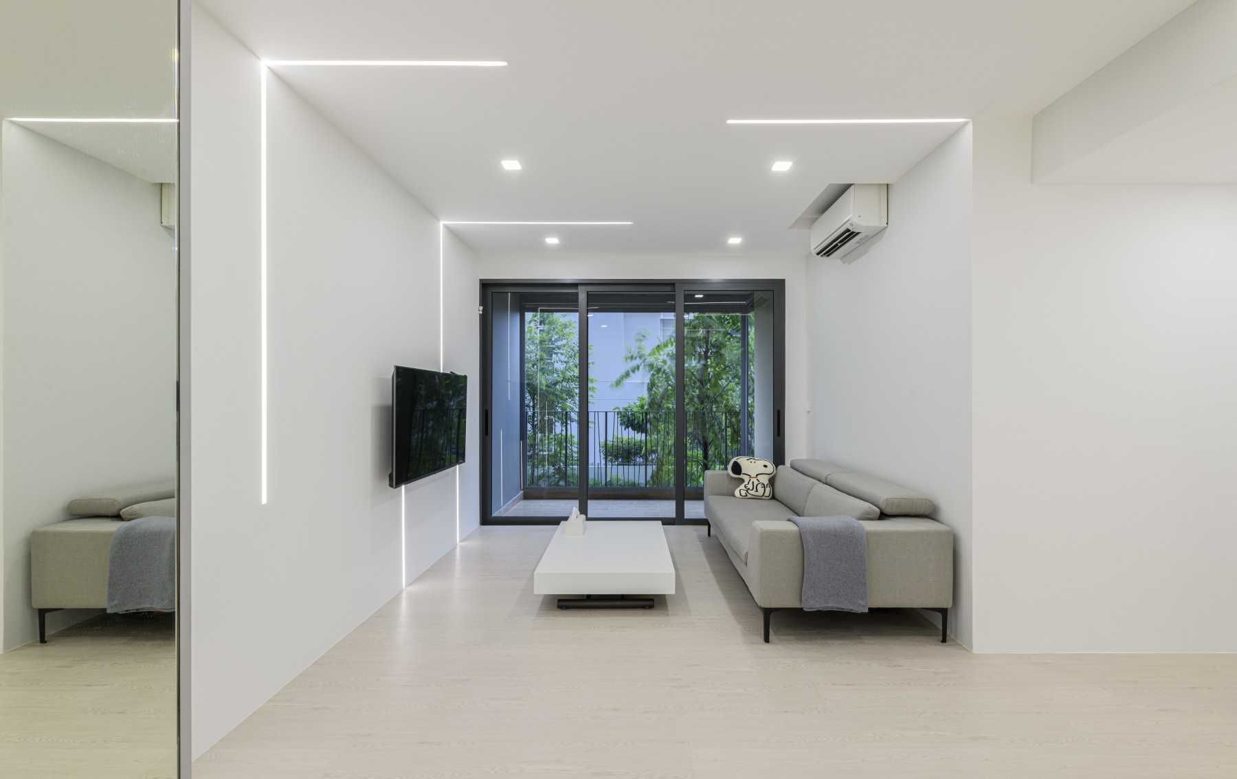 Modern Living Room with Vinyl Flooring and Feature Wall