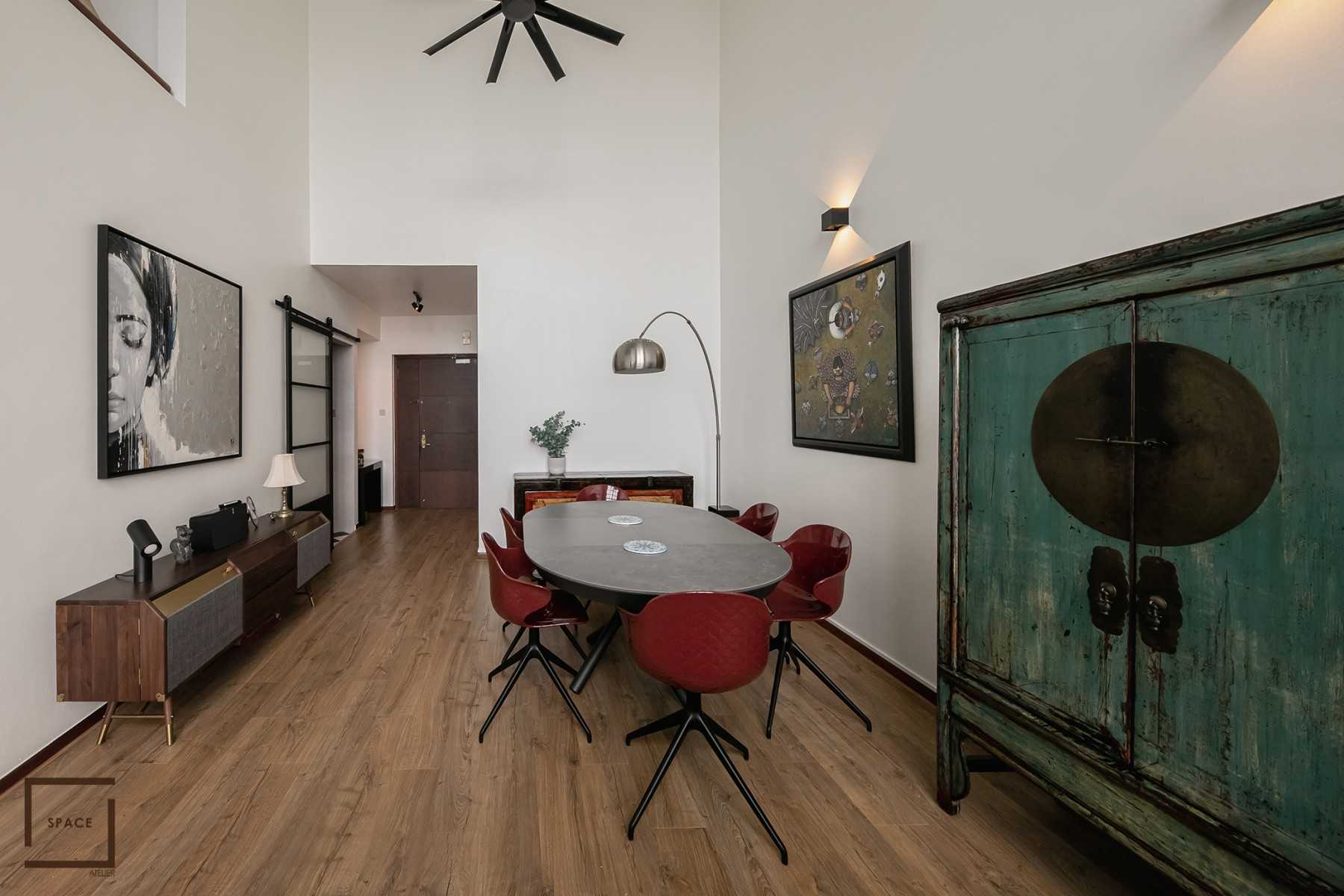 Eclectic Living Room with Drop Light and Sofa