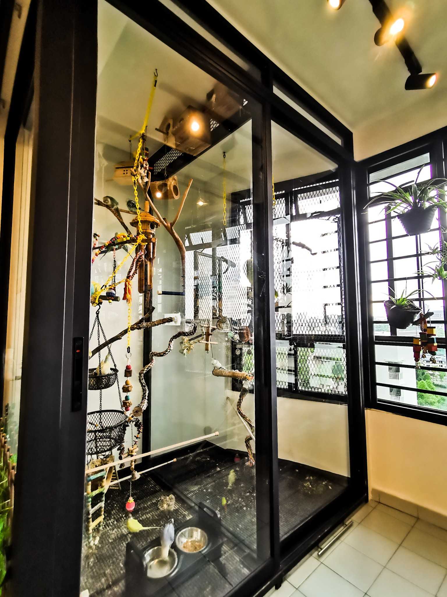 Contemporary Balcony with Glass Door and Window Grille