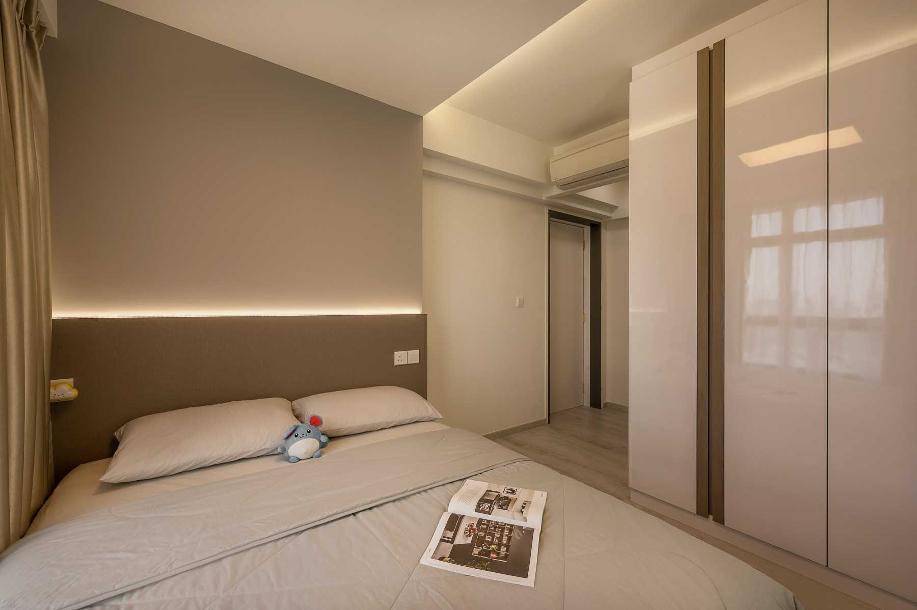Contemporary Bedroom with Cove Lighting and Wardrobe
