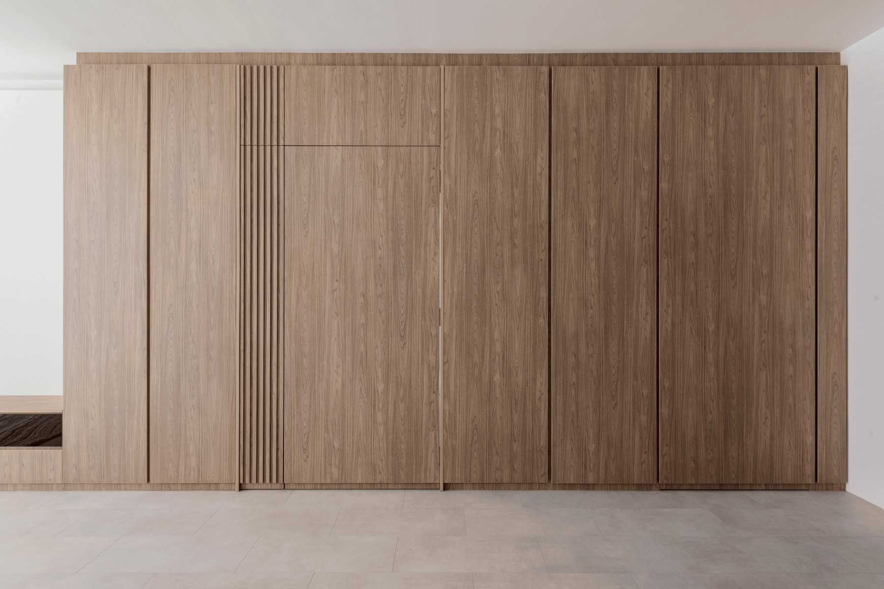 Minimalist Living Room with Feature Wall and Cove Lighting