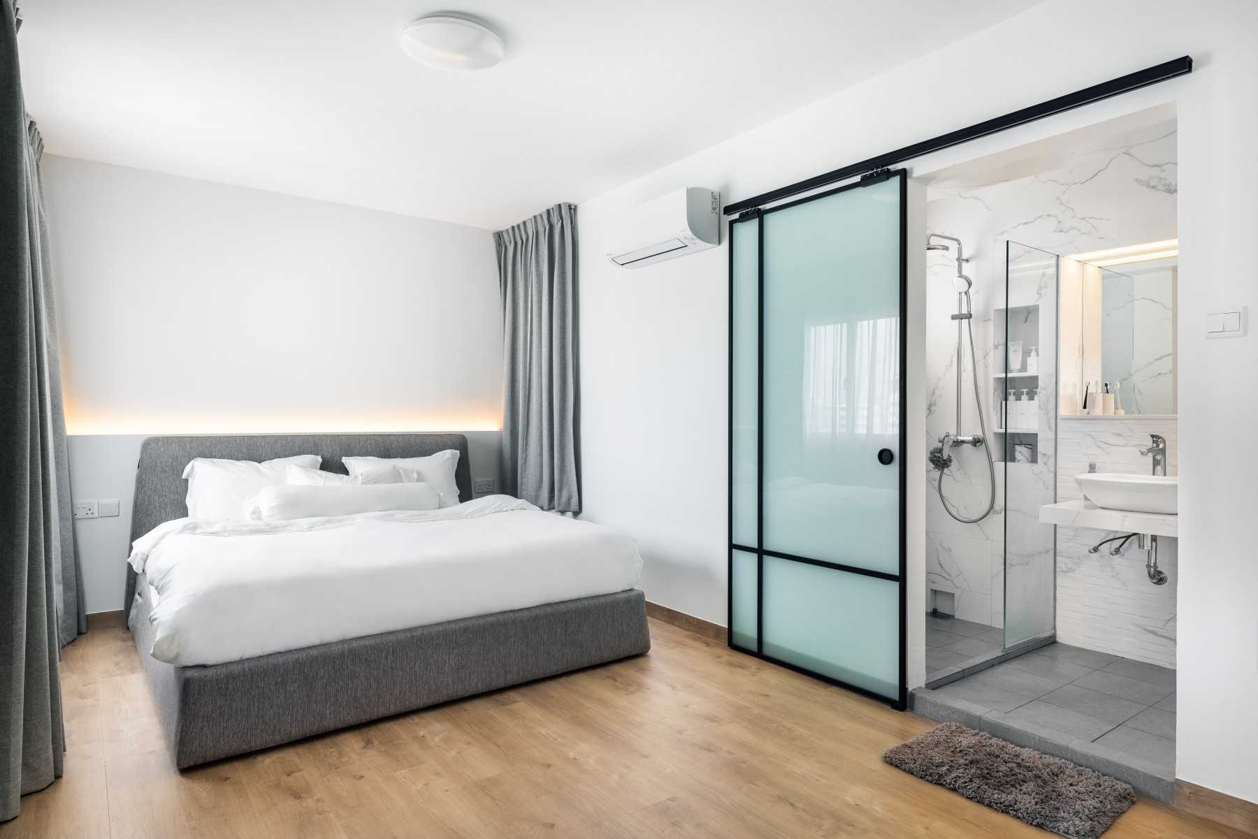 Minimalist Bedroom with Vinyl Flooring and Cove Lighting