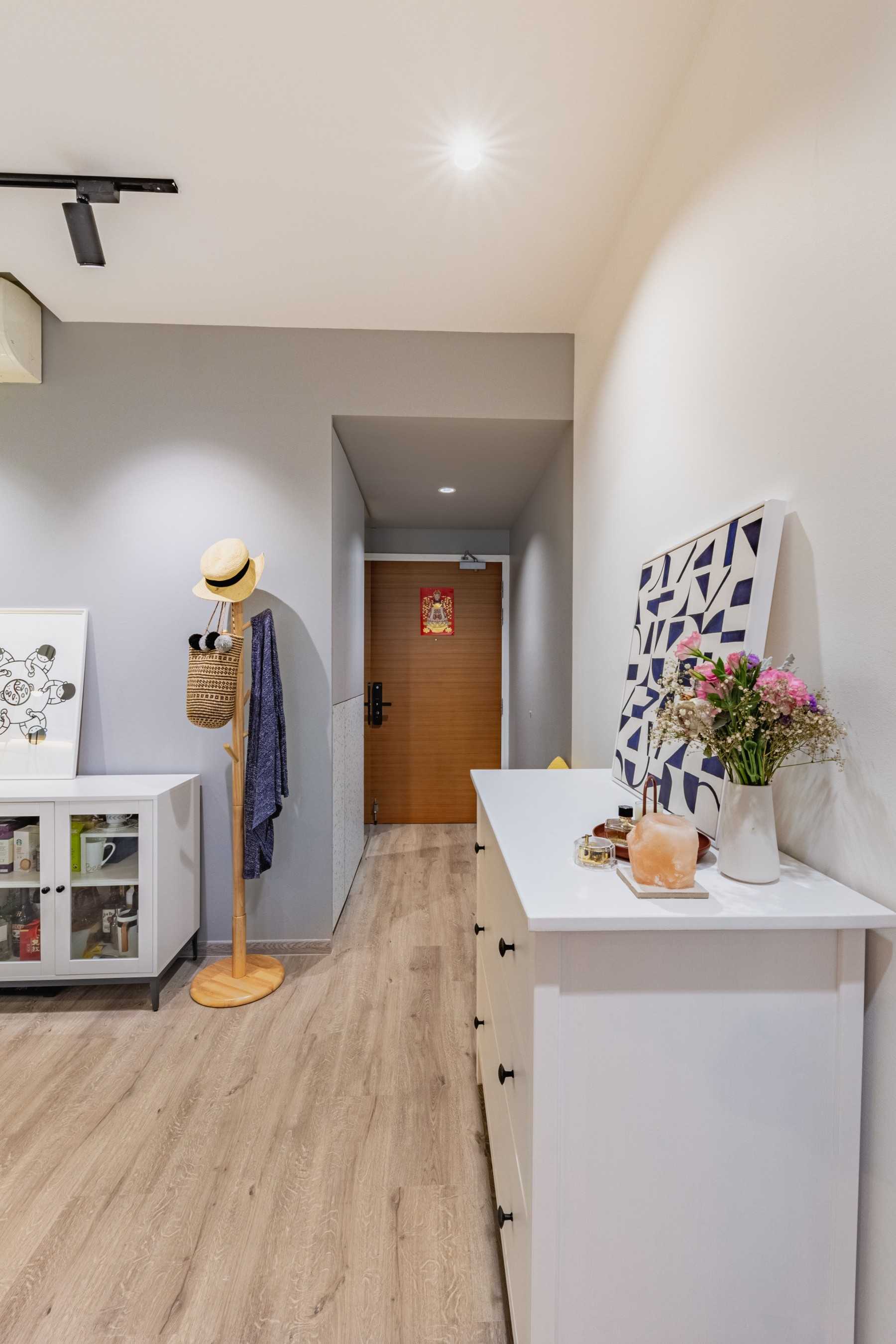 Scandinavian Hallway with Bookshelf and Artwork
