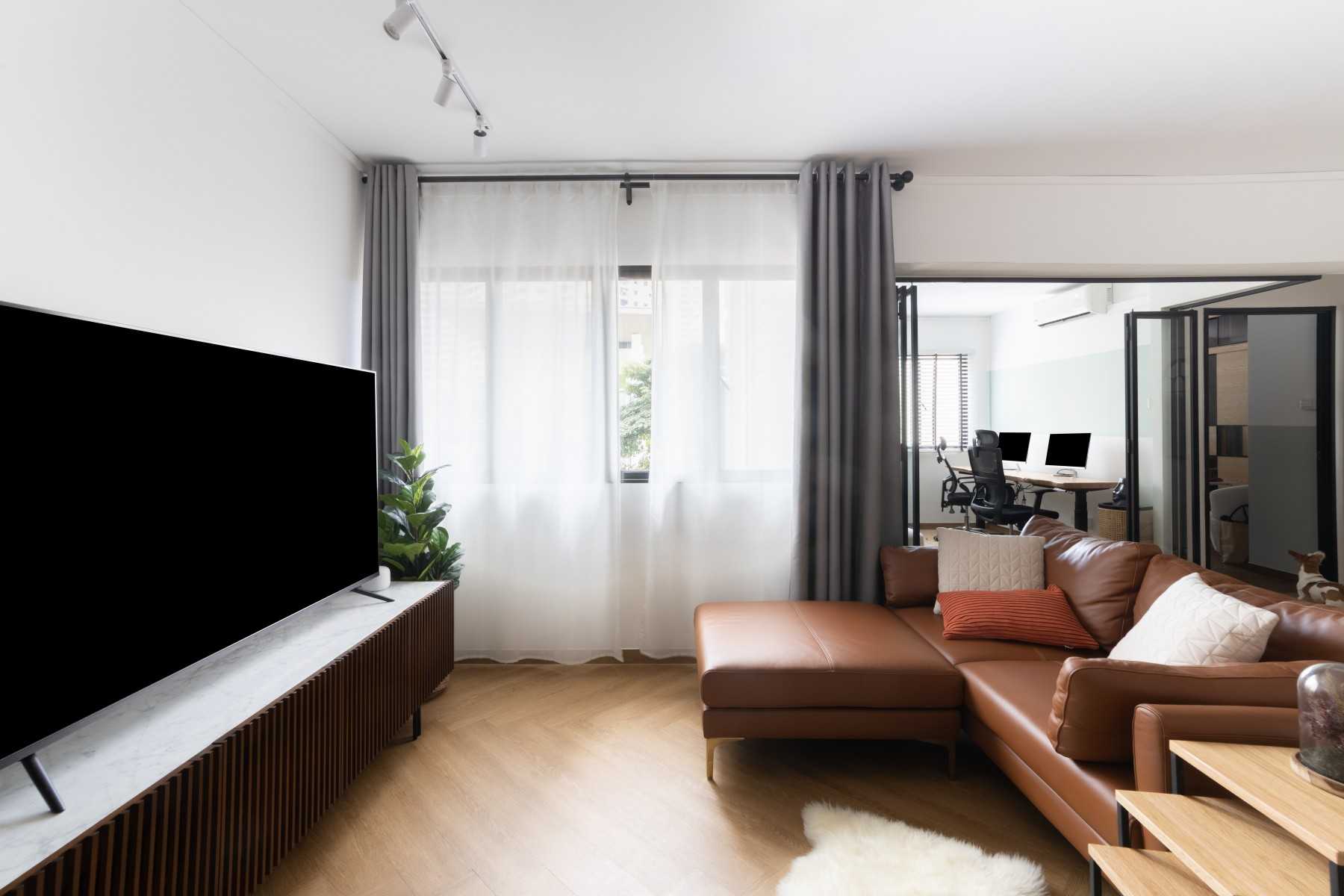 Scandinavian Living Room with Wood Flooring and TV Console