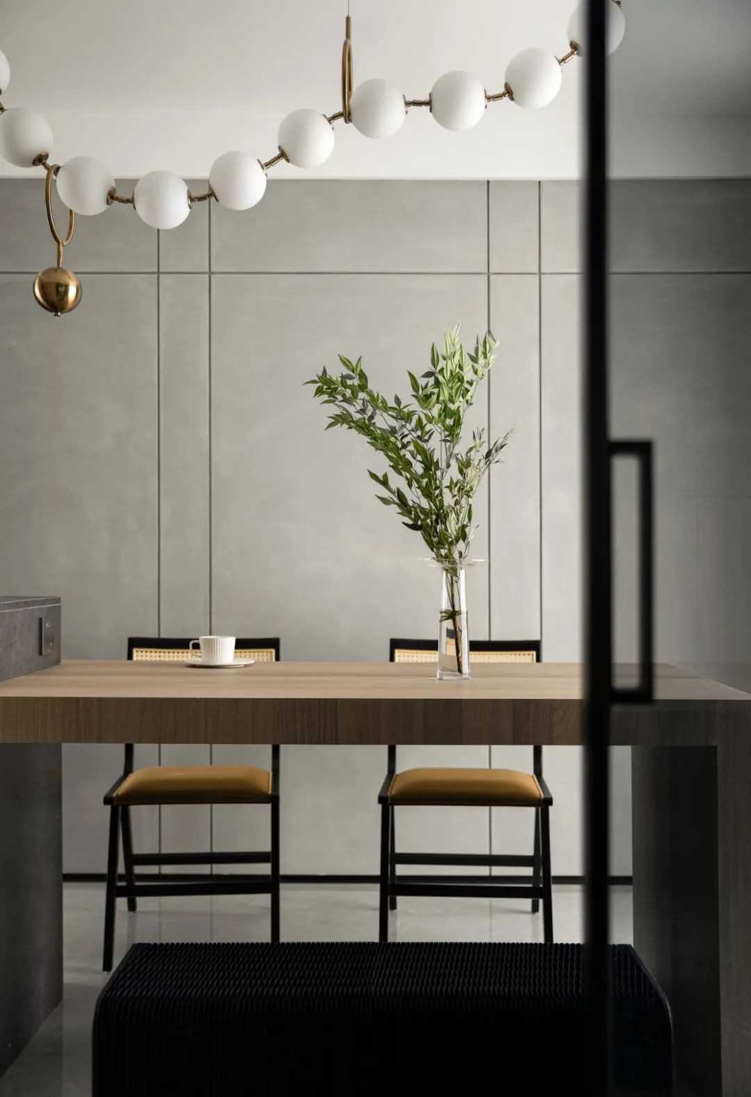 Contemporary Dining Room with Homogeneous Tiles and Feature Wall