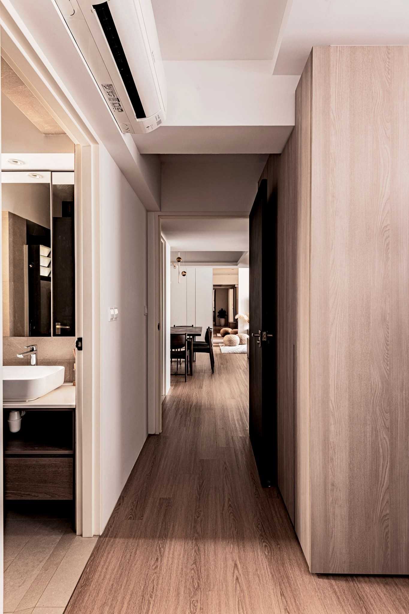 Contemporary Hallway with Bookshelf and Artwork