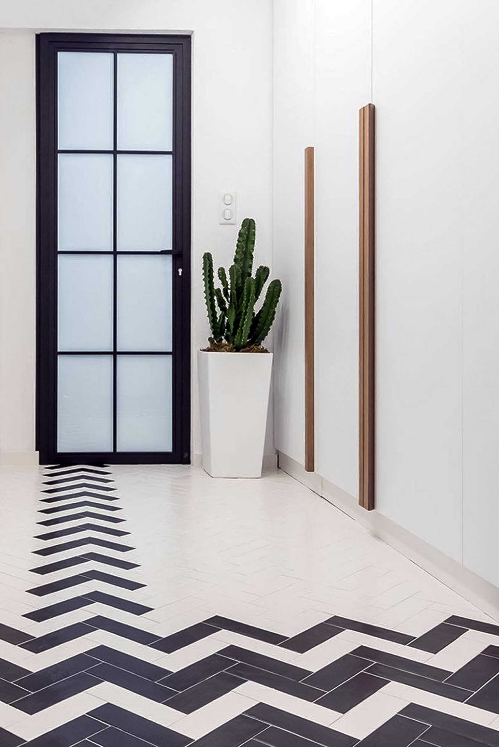 Transitional Hallway with Bookshelf and Artwork