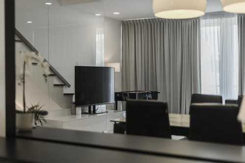 Minimalist Living Room at 2 Storey Apartment at Bowmont Centre