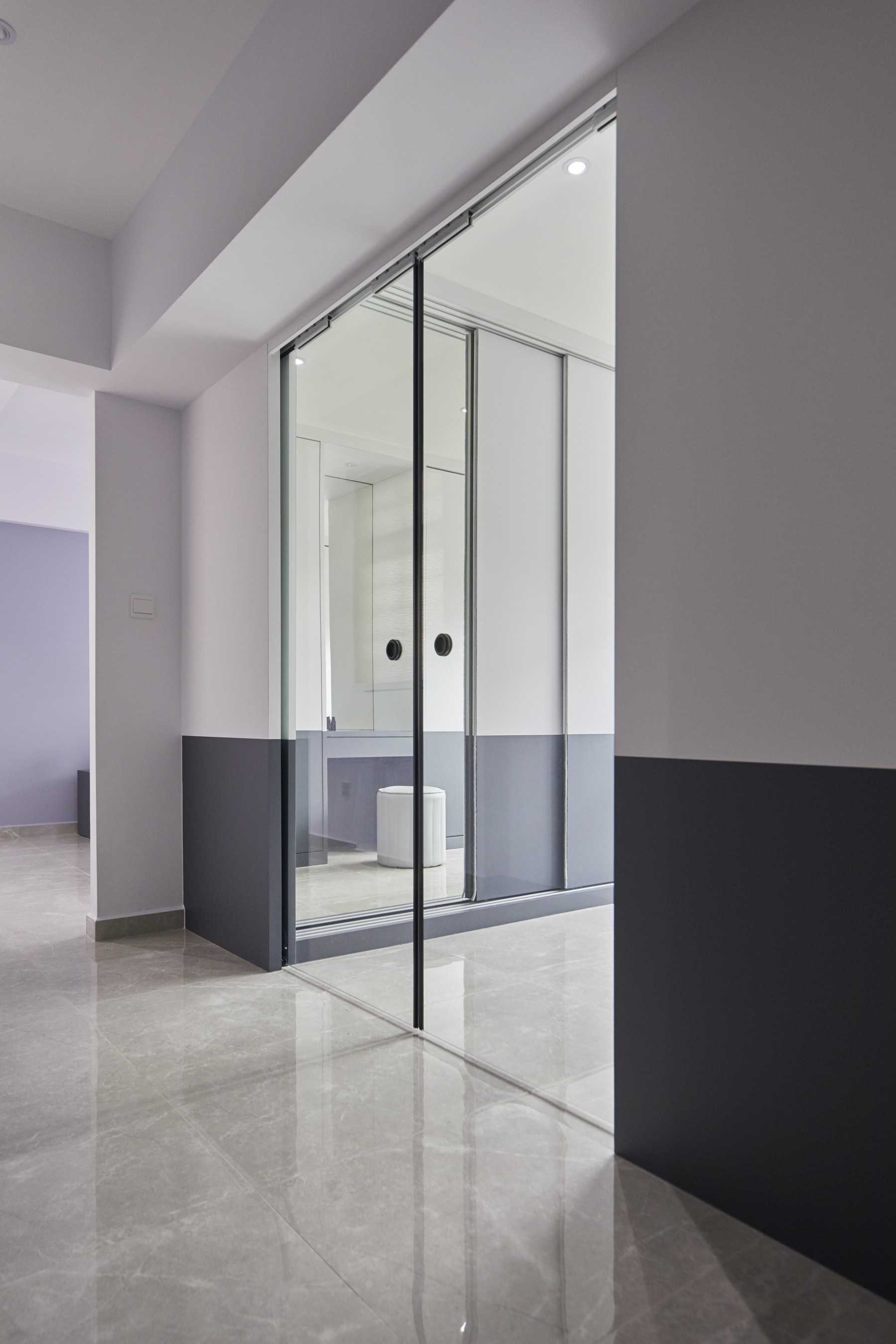 Contemporary Bedroom with Homogeneous Tiles and Glass Door