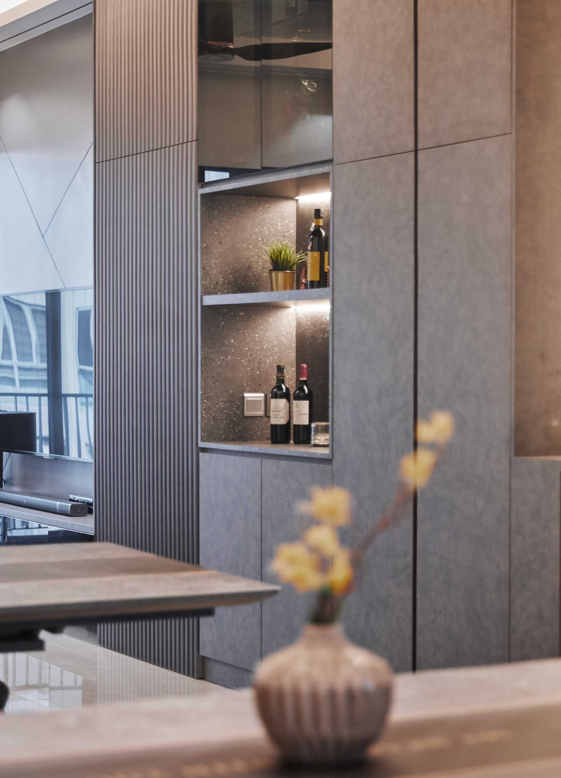 Modern Dining Room with Cove Lighting and Display Cabinets
