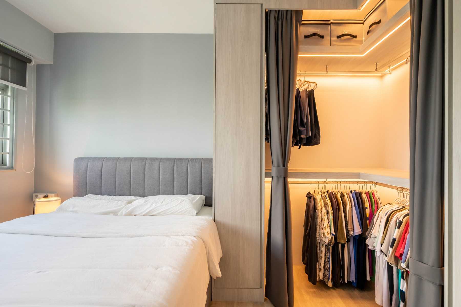 Industrial Bedroom with Wood Flooring and Wardrobe