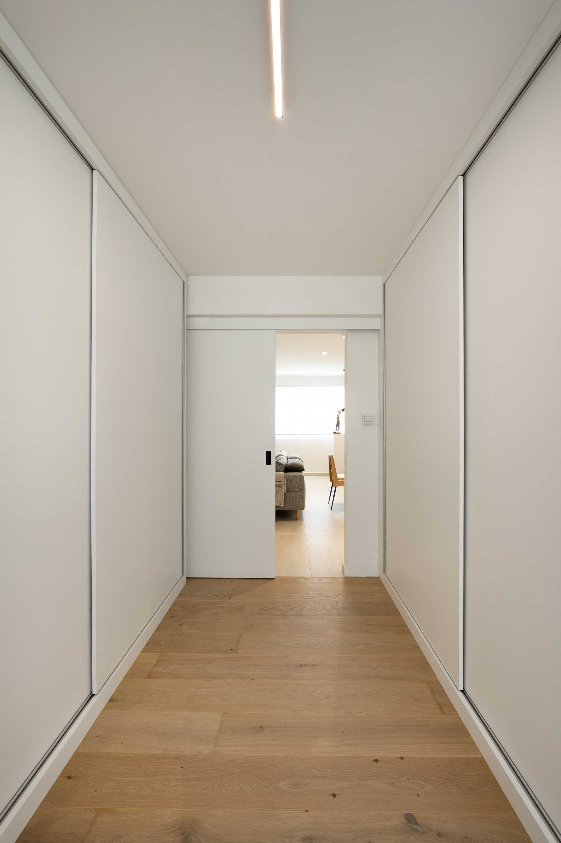 Eclectic Bedroom with Wood Flooring and Wardrobe