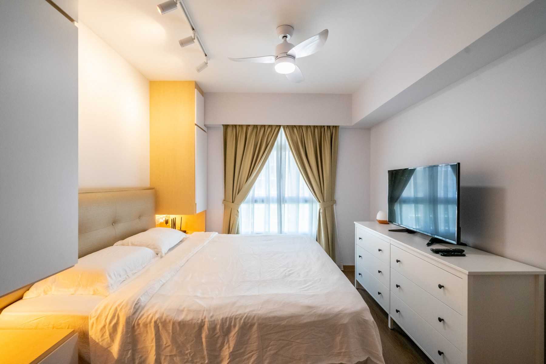 Modern Bedroom with Wood Flooring and Ceiling Light