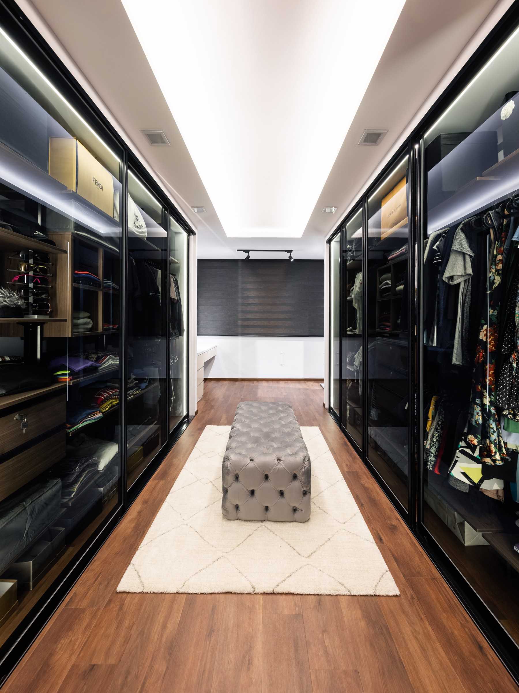 Contemporary Walk-in Wardrobe with Settee and Cove Lighting