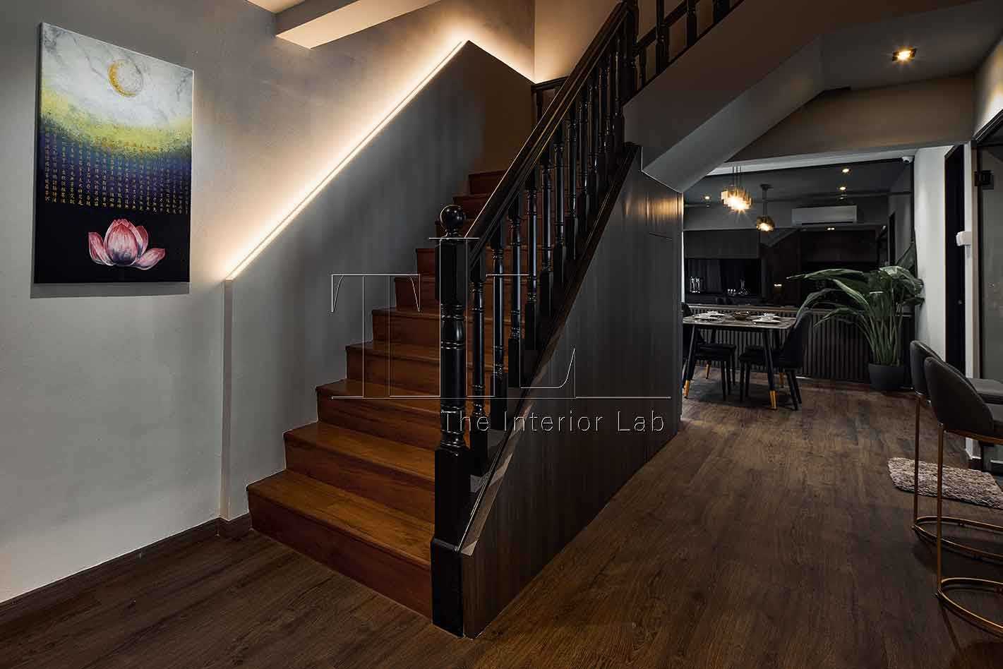 Modern Entryway with Staircase and Paintings