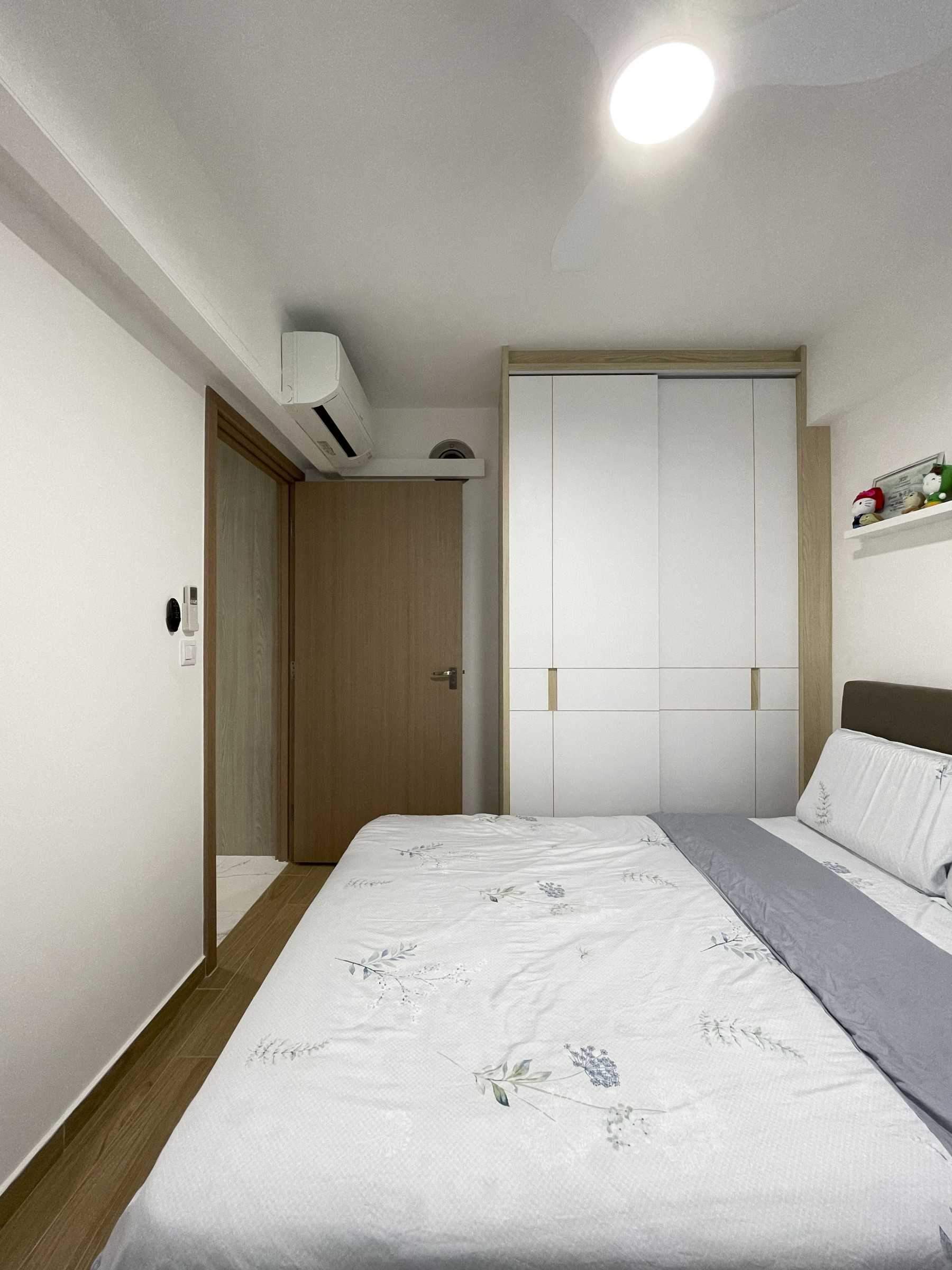 Scandinavian Bedroom with Wardrobe and Paintings