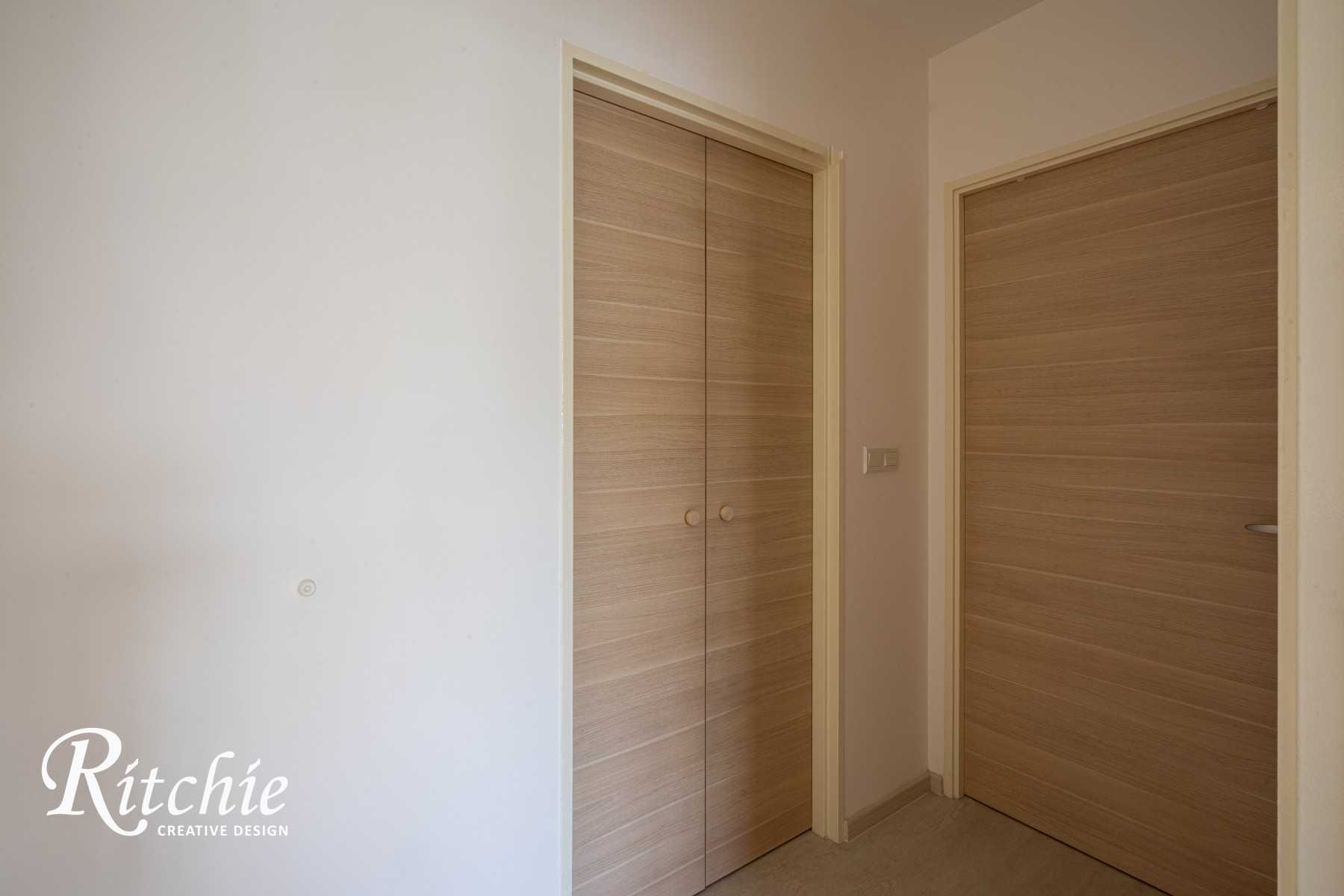 Minimalist Entryway with Doors and Wood Doors