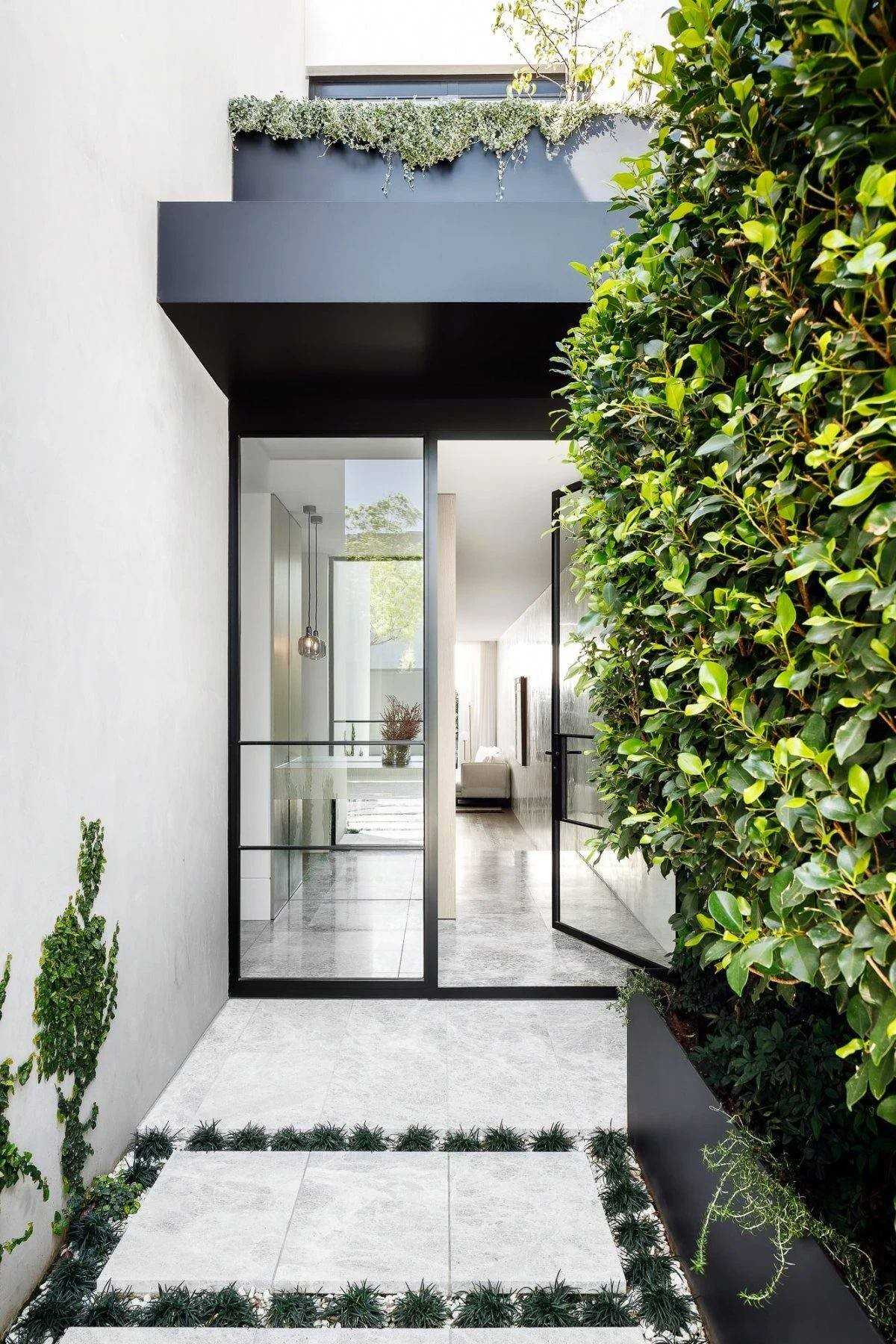 Contemporary Entryway with Homogeneous Tiles and Marble Floor