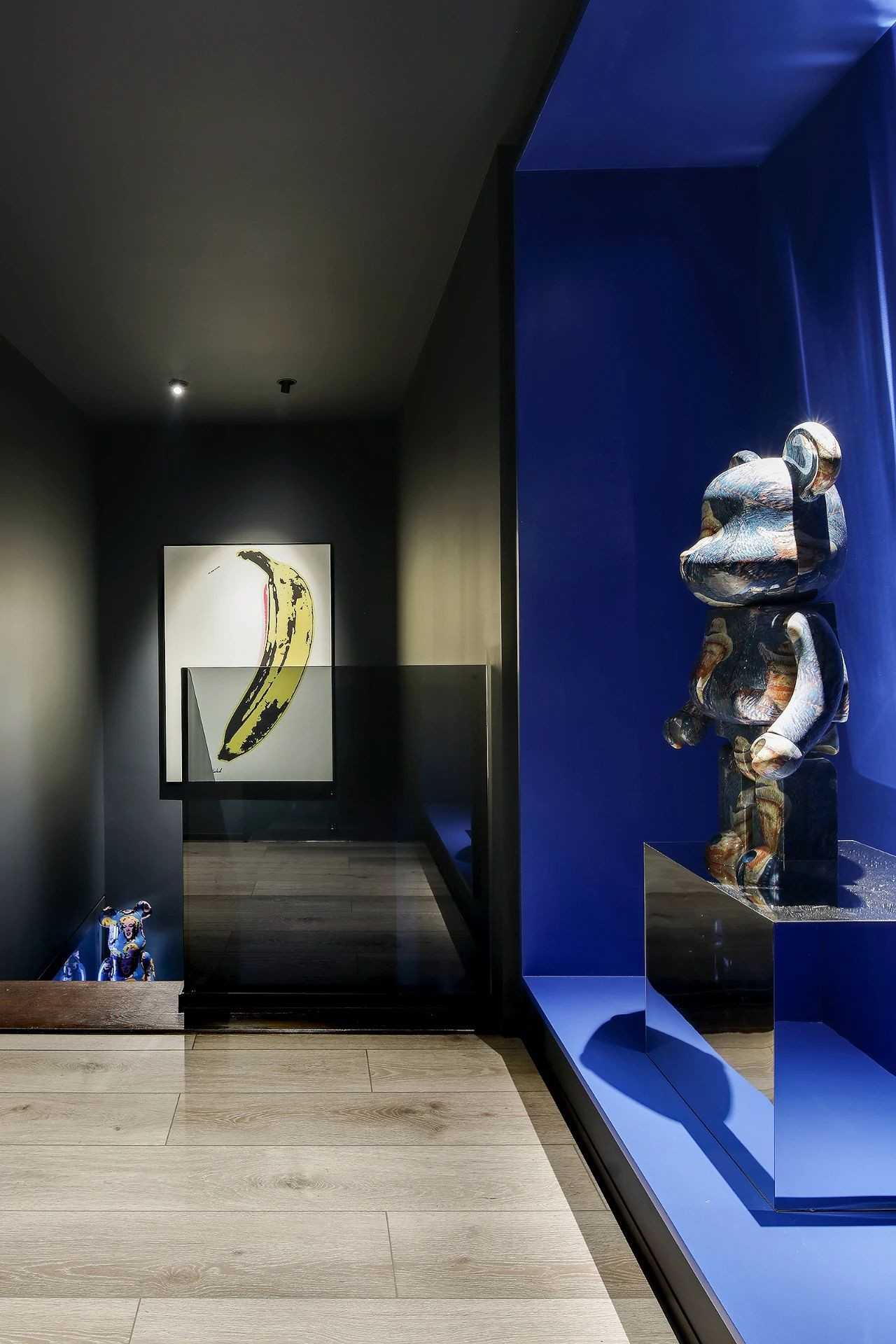 Contemporary Foyer with Parquet Floor and Artwork