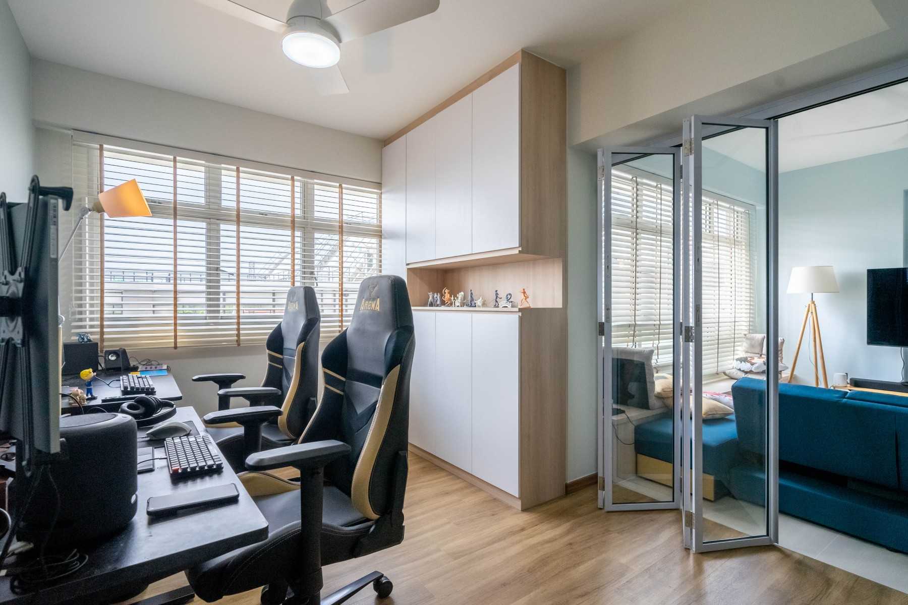 Modern Study with Cove Lighting and Storage Cabinets