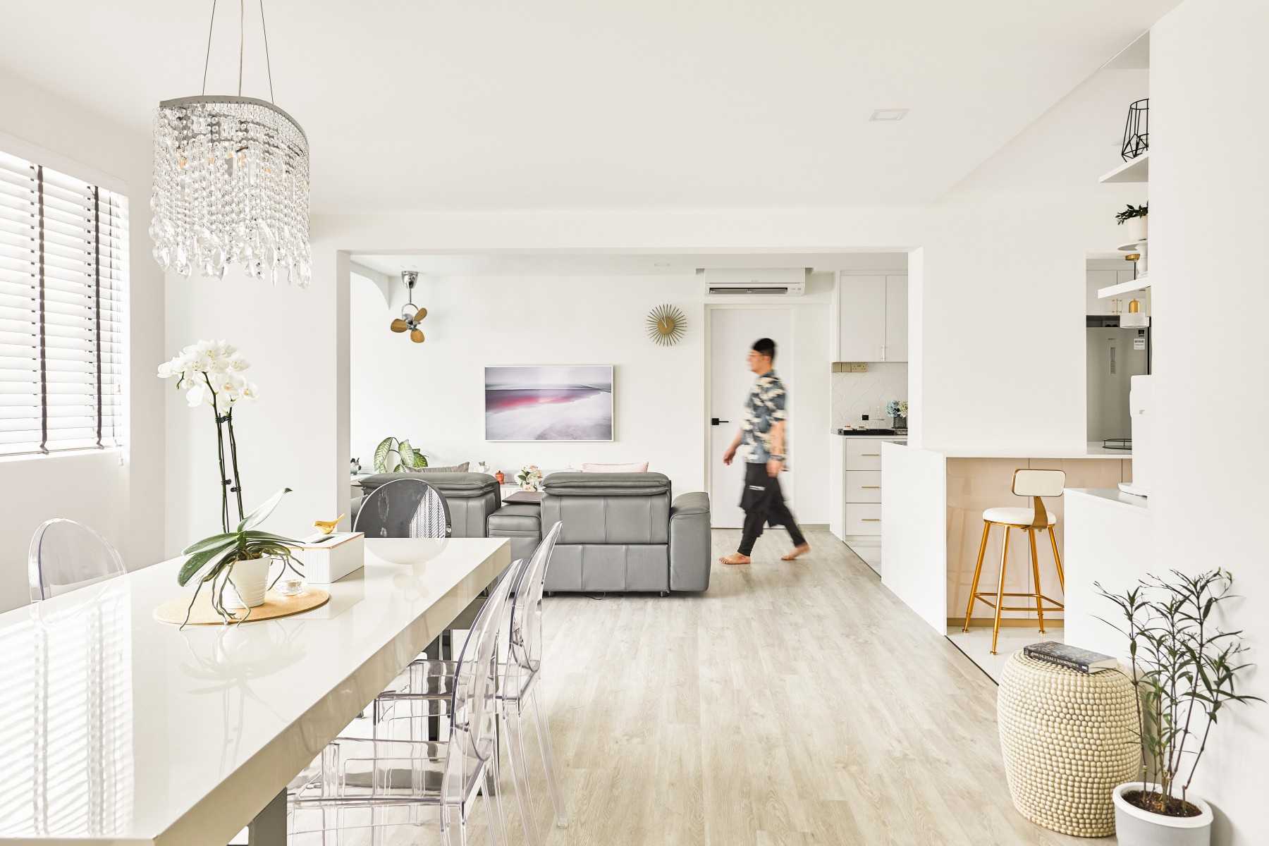 Modern Dining Room with Chandelier and Sofa