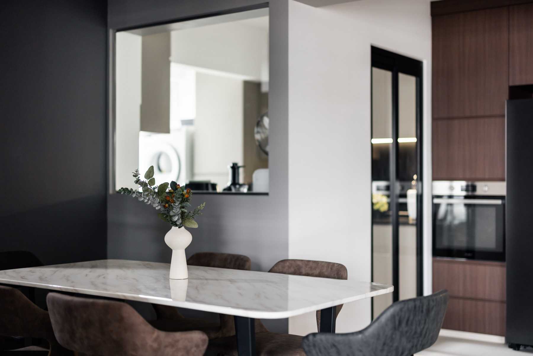 Industrial Dining Room with Glass Door and Dining Table