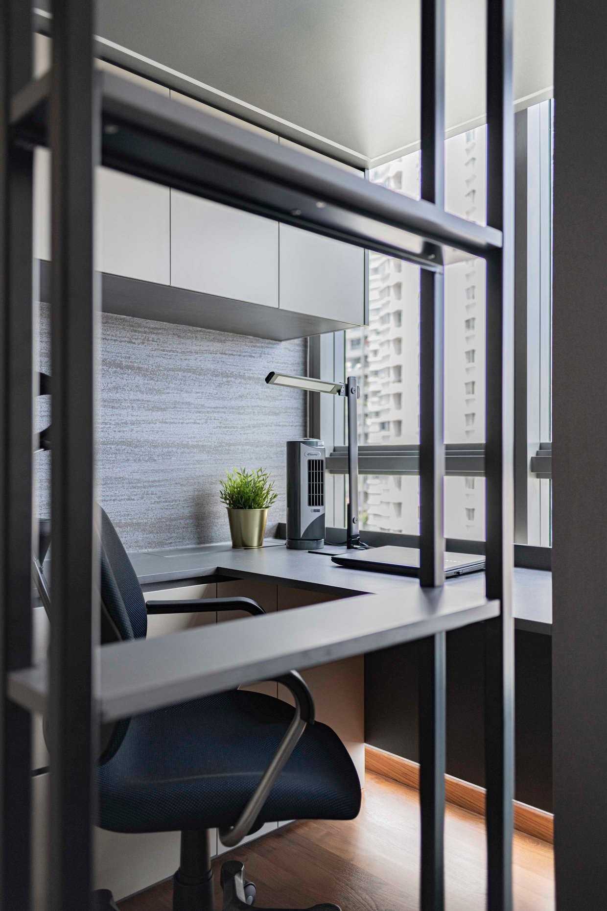 Contemporary Home Office with Bookshelf and Wallpaper