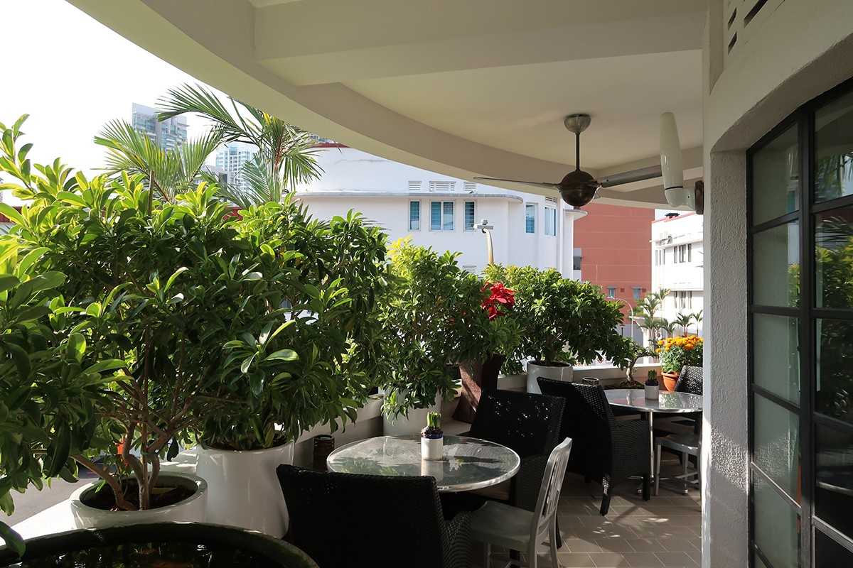 Modern Balcony with Window Grille and Outdoor Table