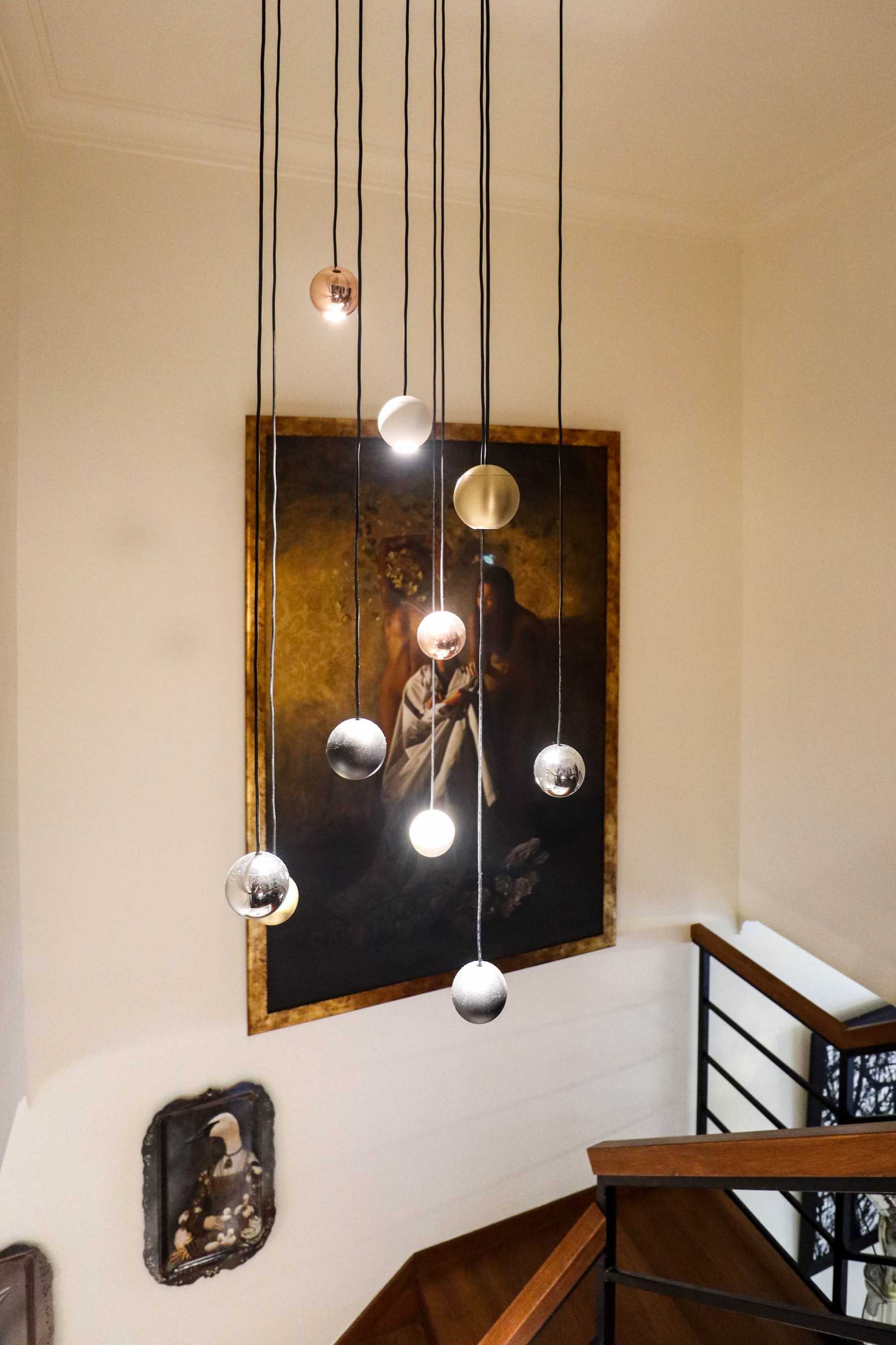 Eclectic Foyer with Staircase and Artwork