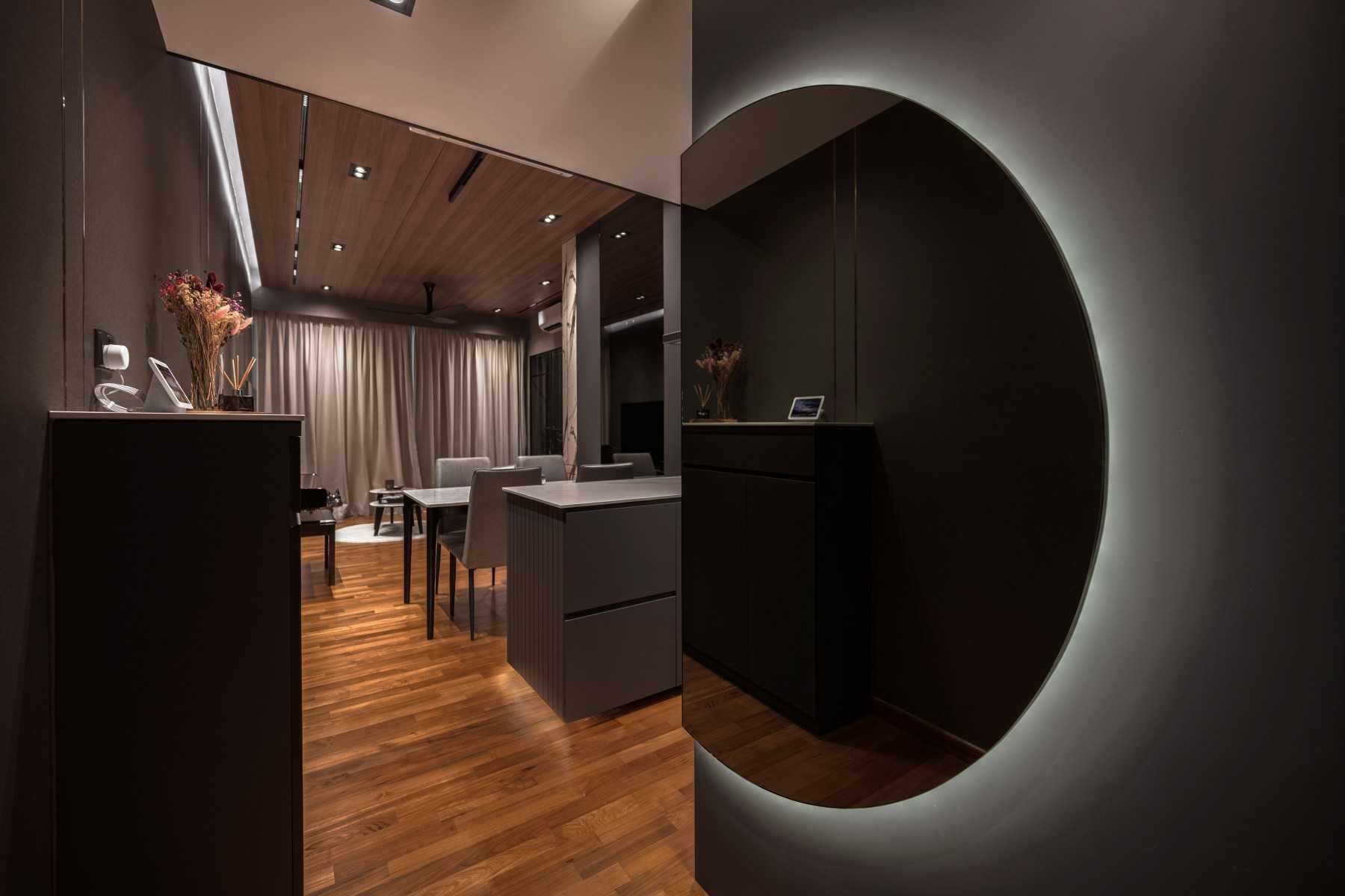 Modern Entryway with Wood Flooring and Mirror