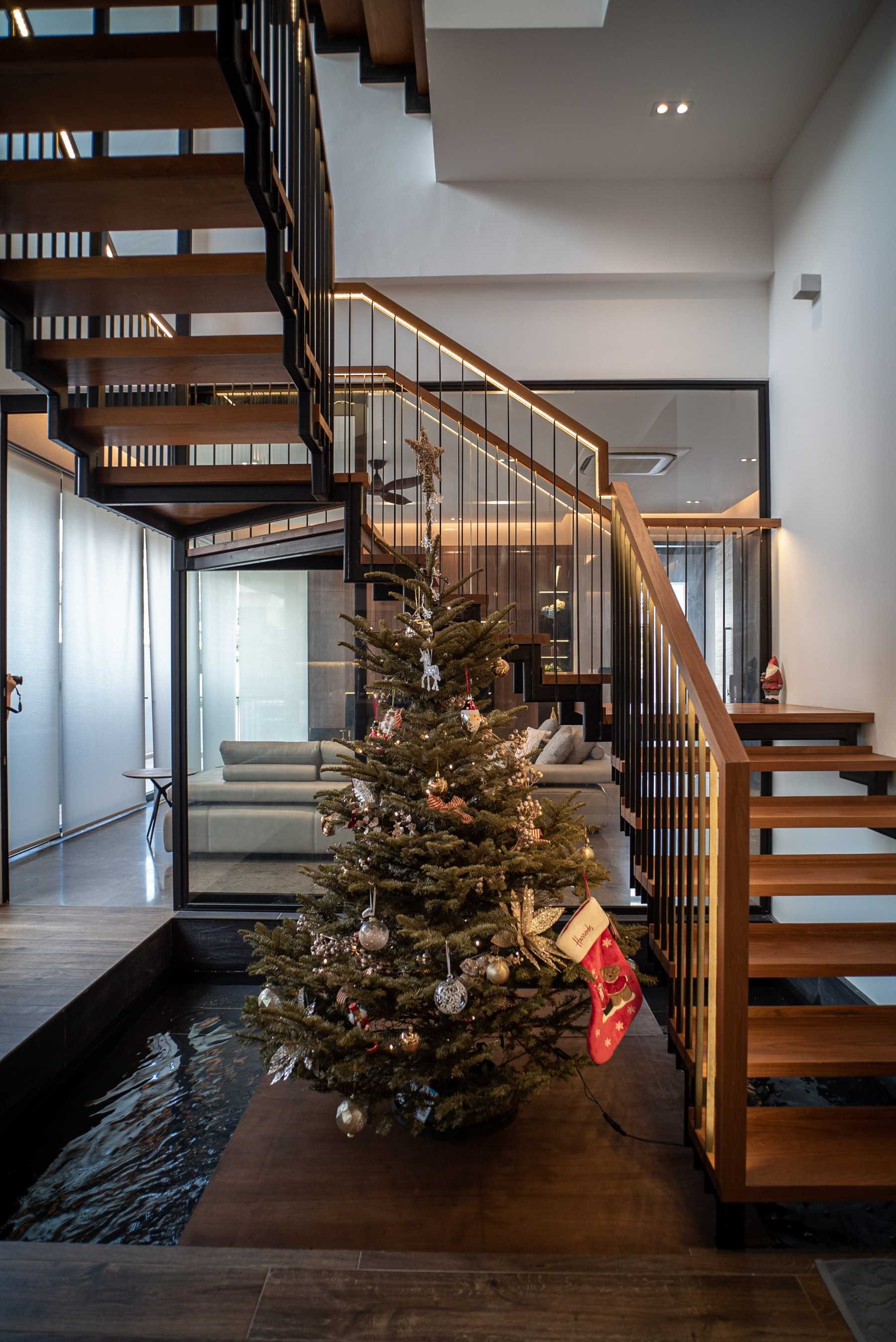 Contemporary Foyer with Wood Flooring and Staircase