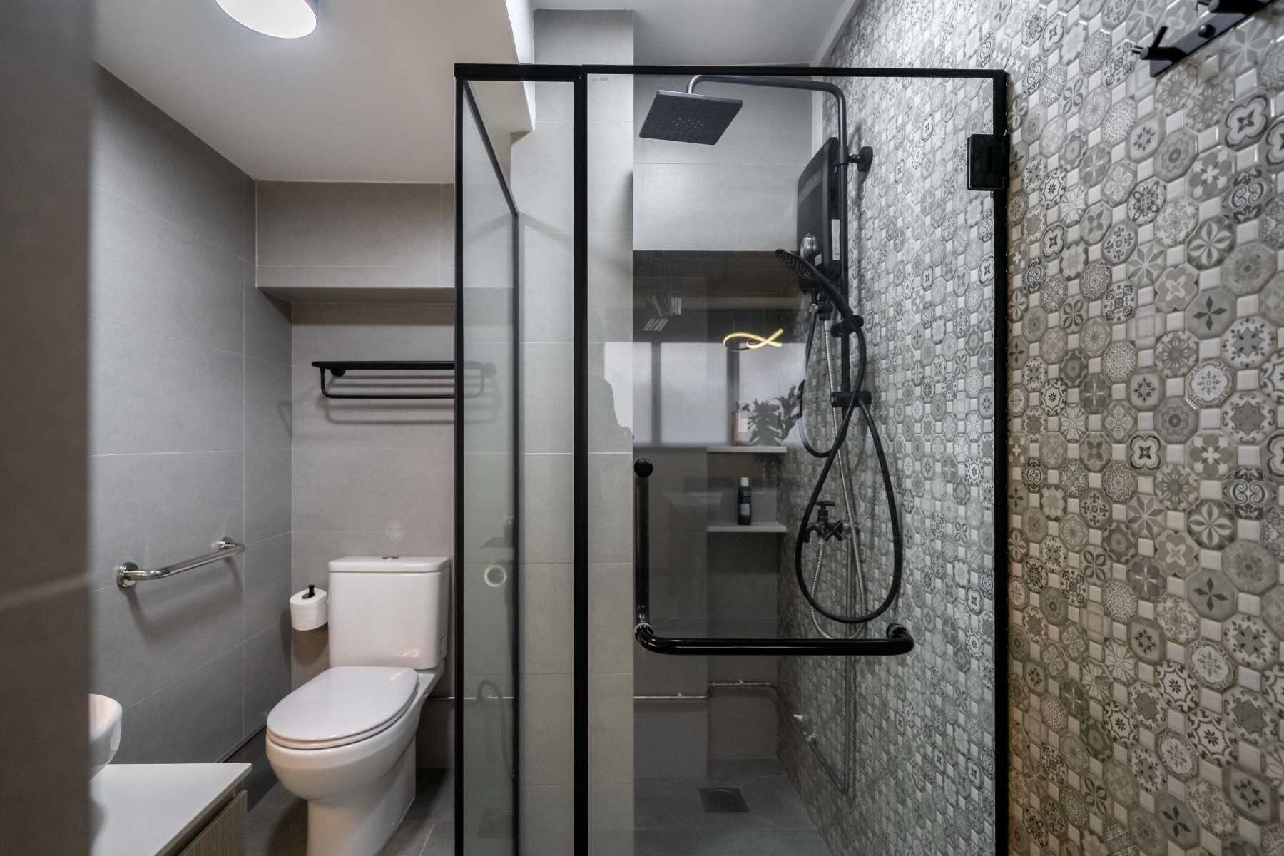 Modern Bathroom with Herringbone Tiling and Mirror