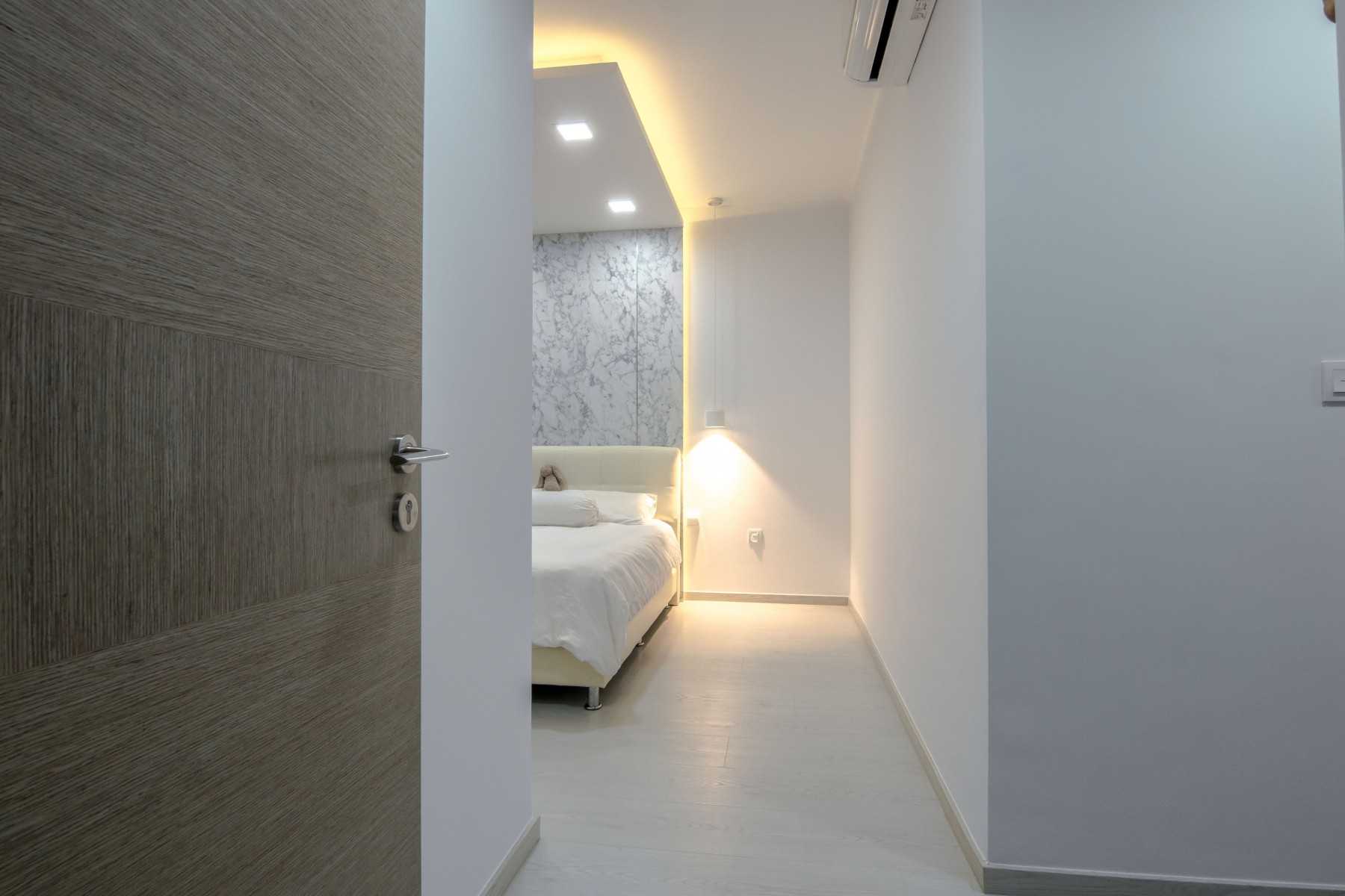 Modern Bedroom with Feature Wall and Ceiling Light
