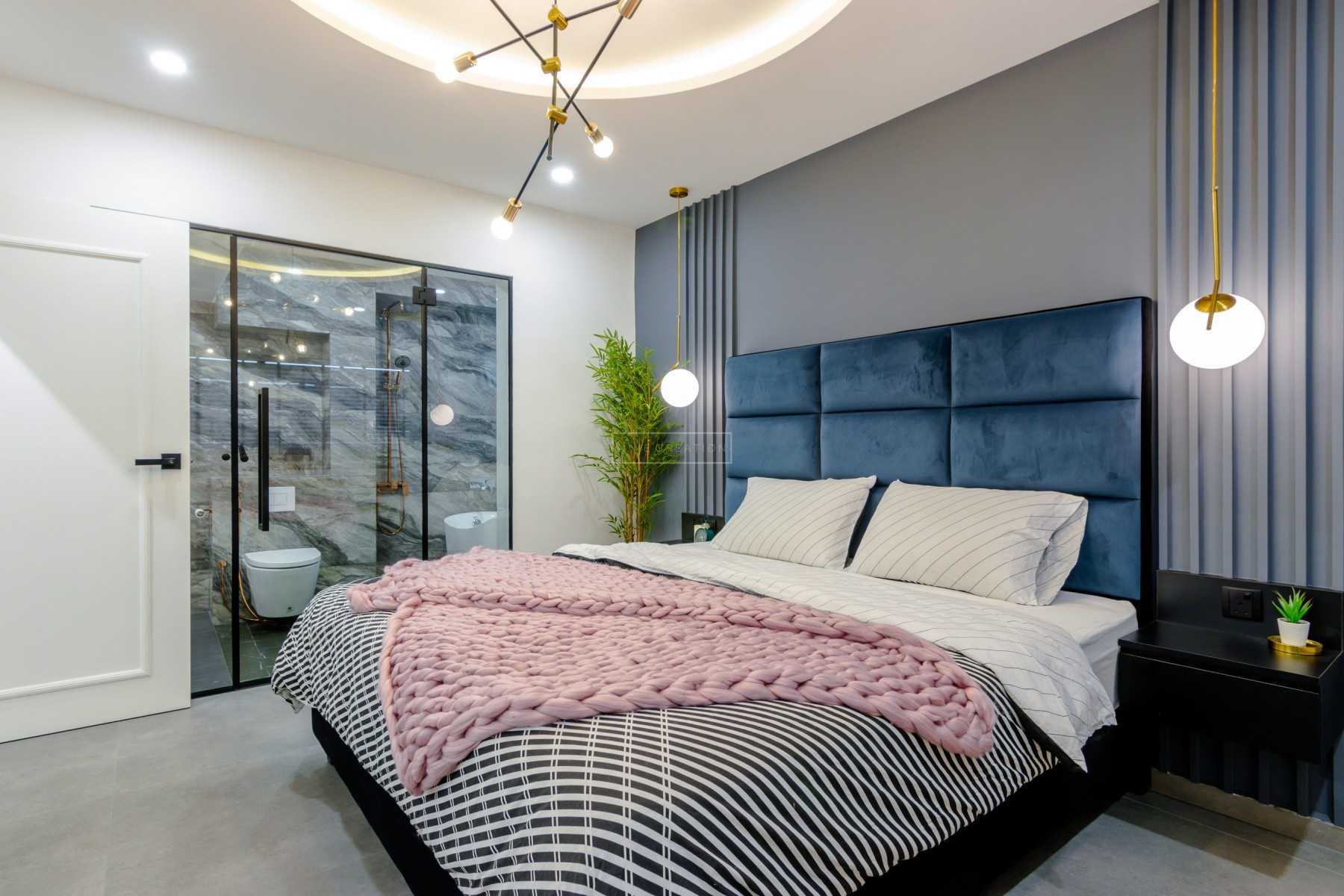 Contemporary Bedroom with Feature Wall and Cove Lighting
