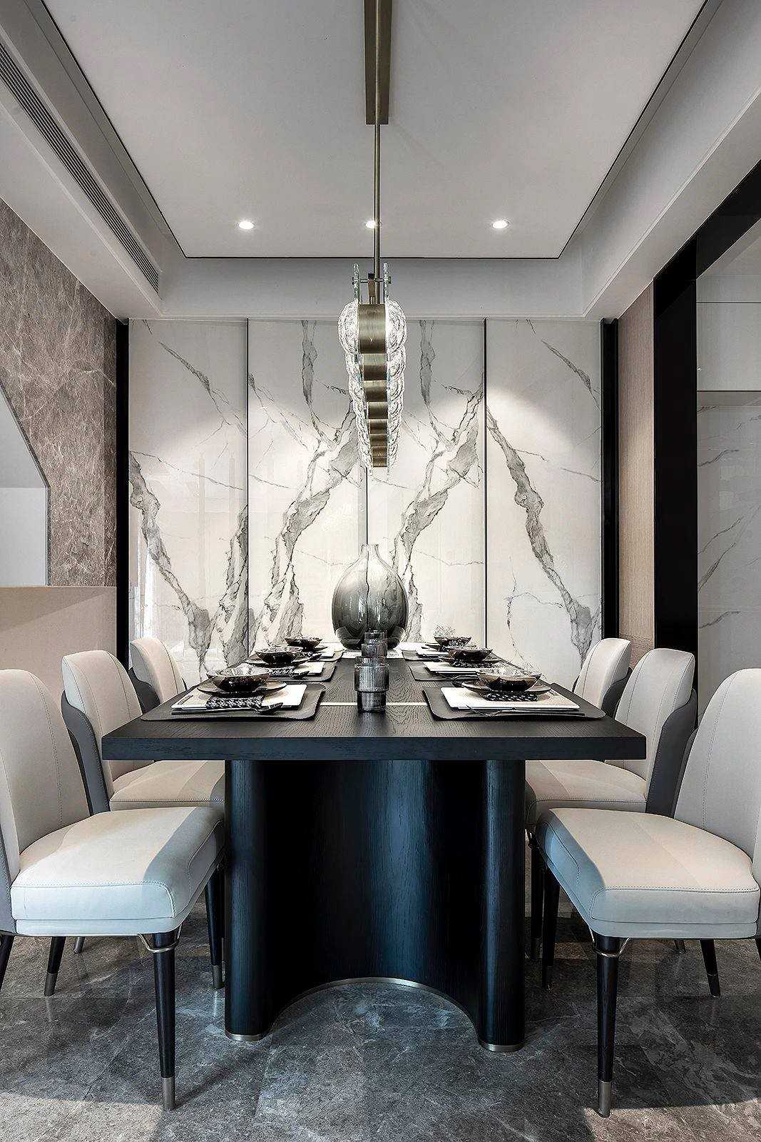 Contemporary Dining Room with Feature Wall and Drop Light