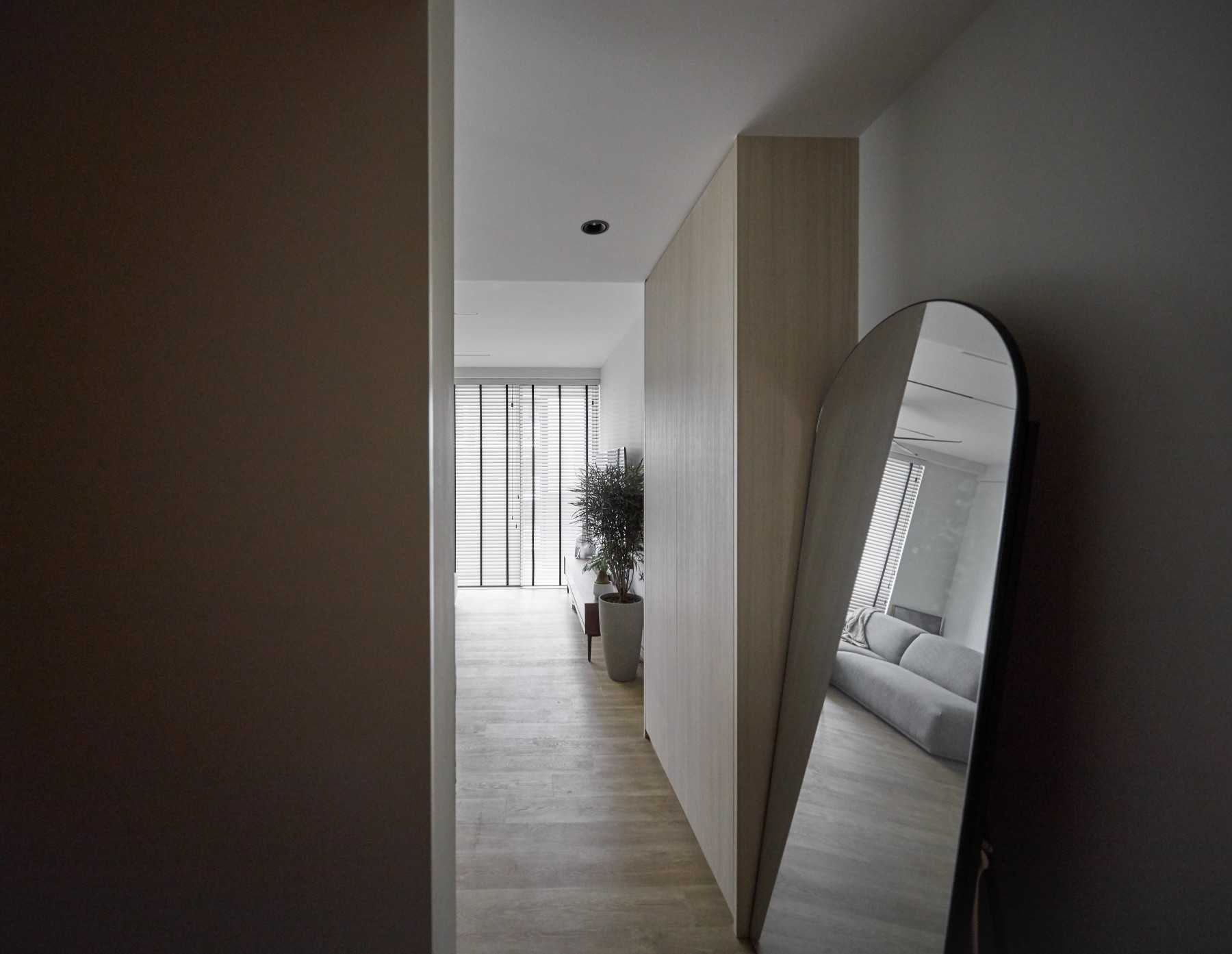 Scandinavian Living Room with Mirror and Storage Cabinets