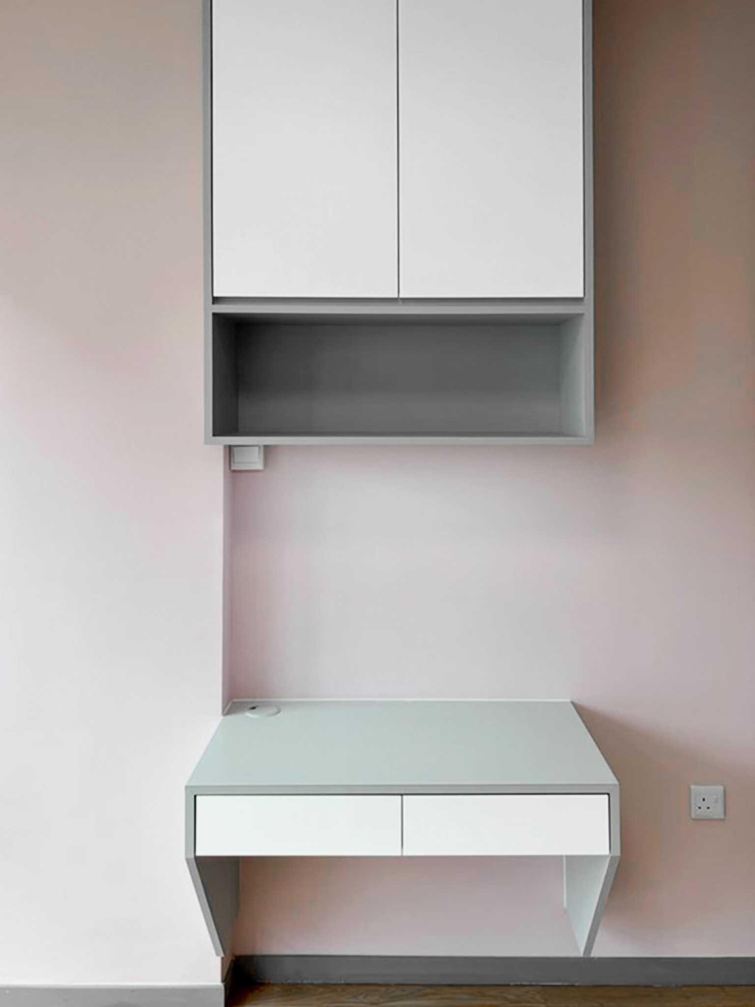 Scandinavian Bedroom with Paintings and Desk