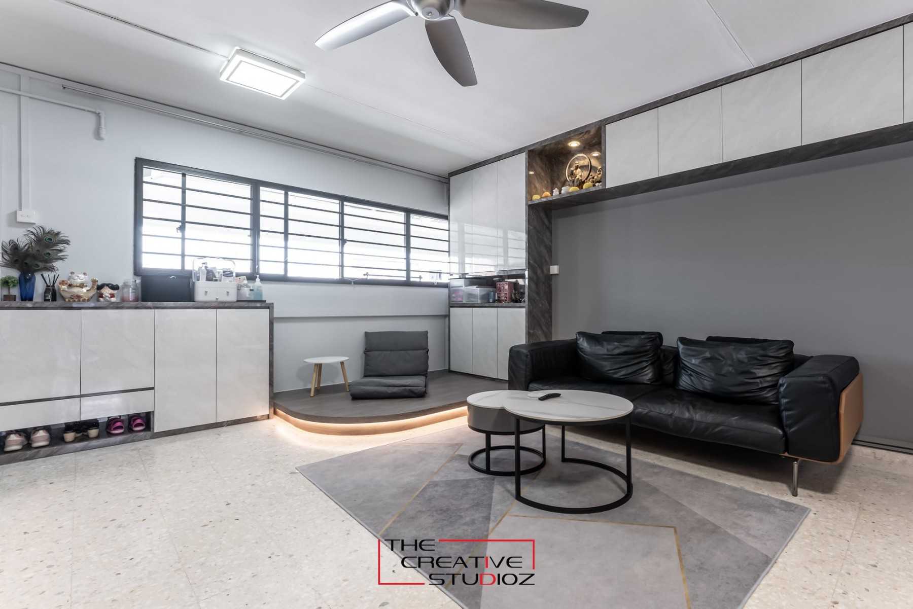 Modern Living Room with Bookshelf and Homogeneous Tiles