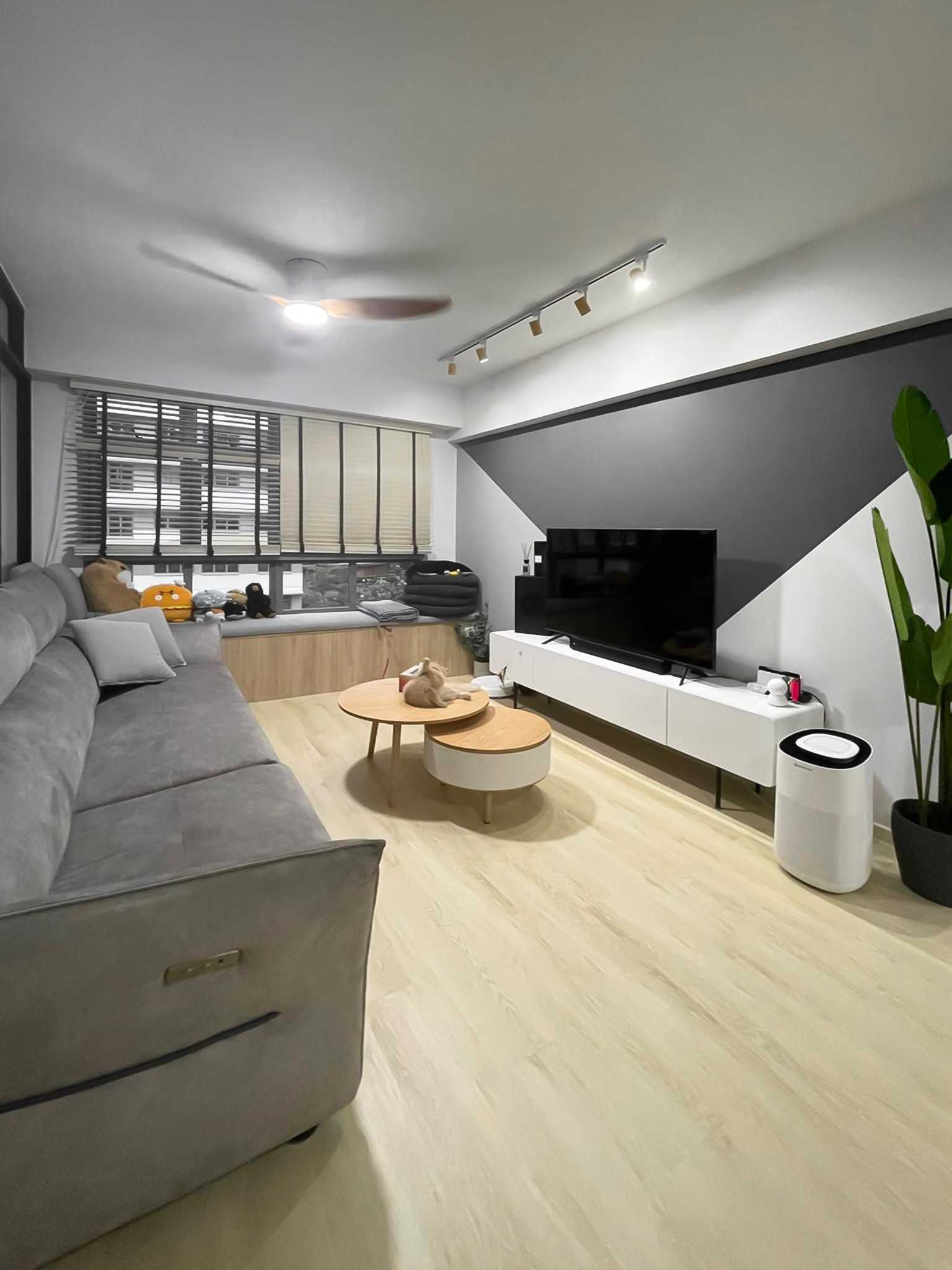 Scandinavian Living Room with TV Console and Window Seat
