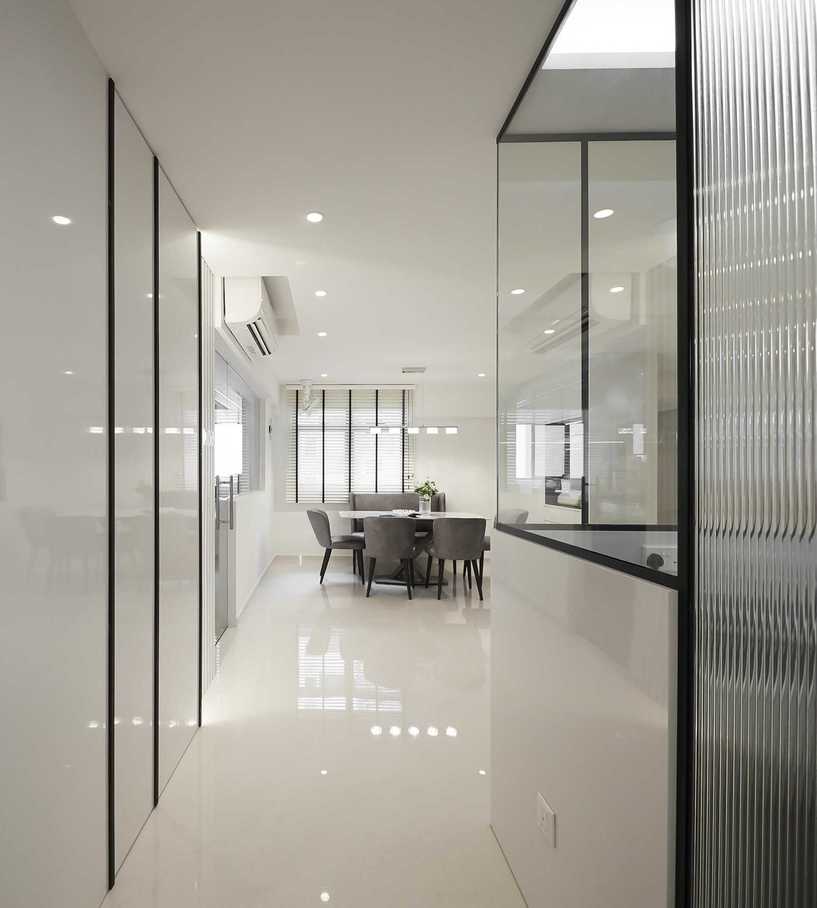 Modern Foyer with Glass Door and Paintings