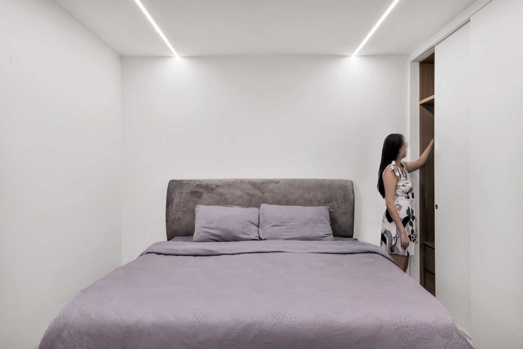 Minimalist Bedroom with Drop Light and Ceiling Light