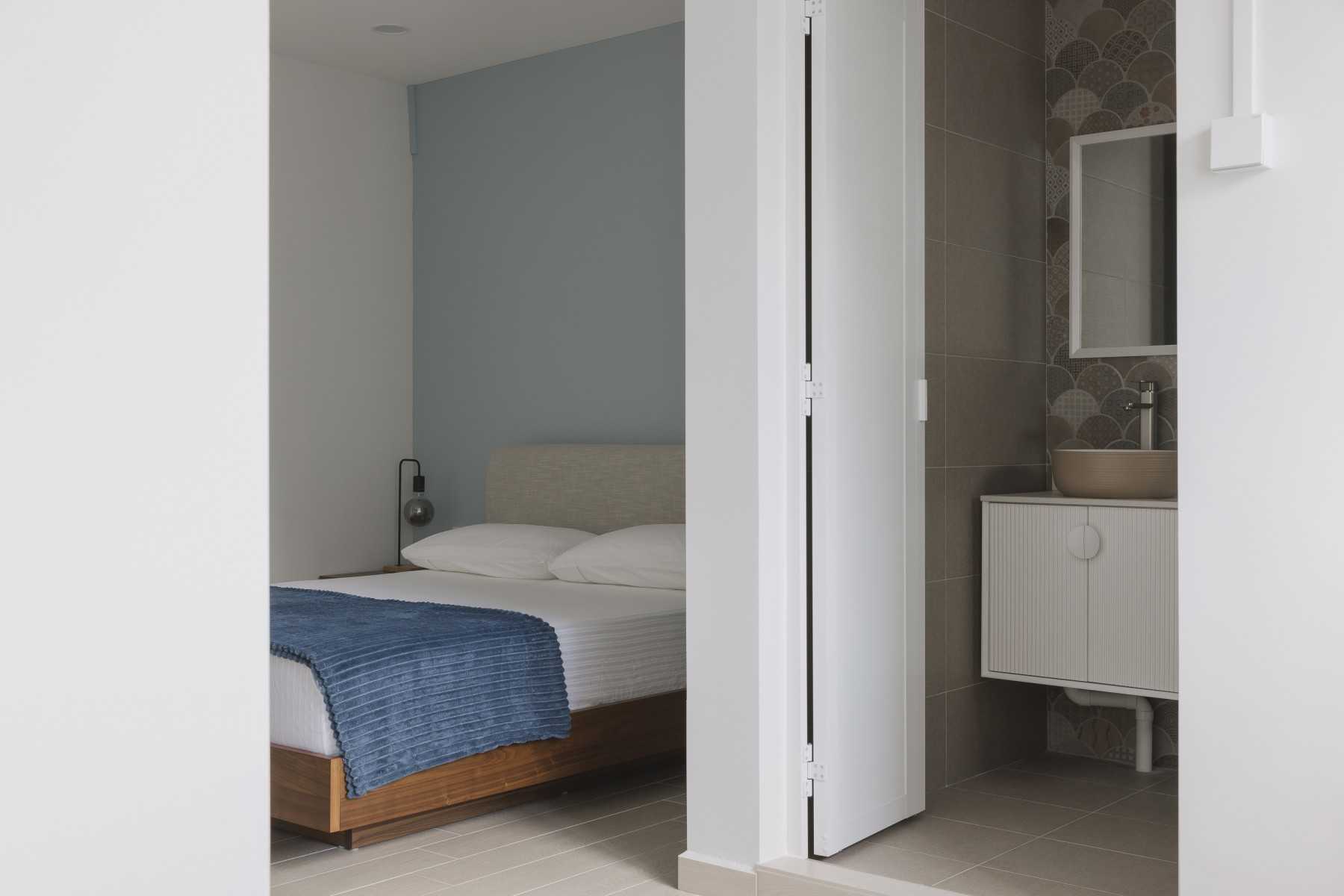 Scandinavian Bedroom with Mirror and Bathroom Storage