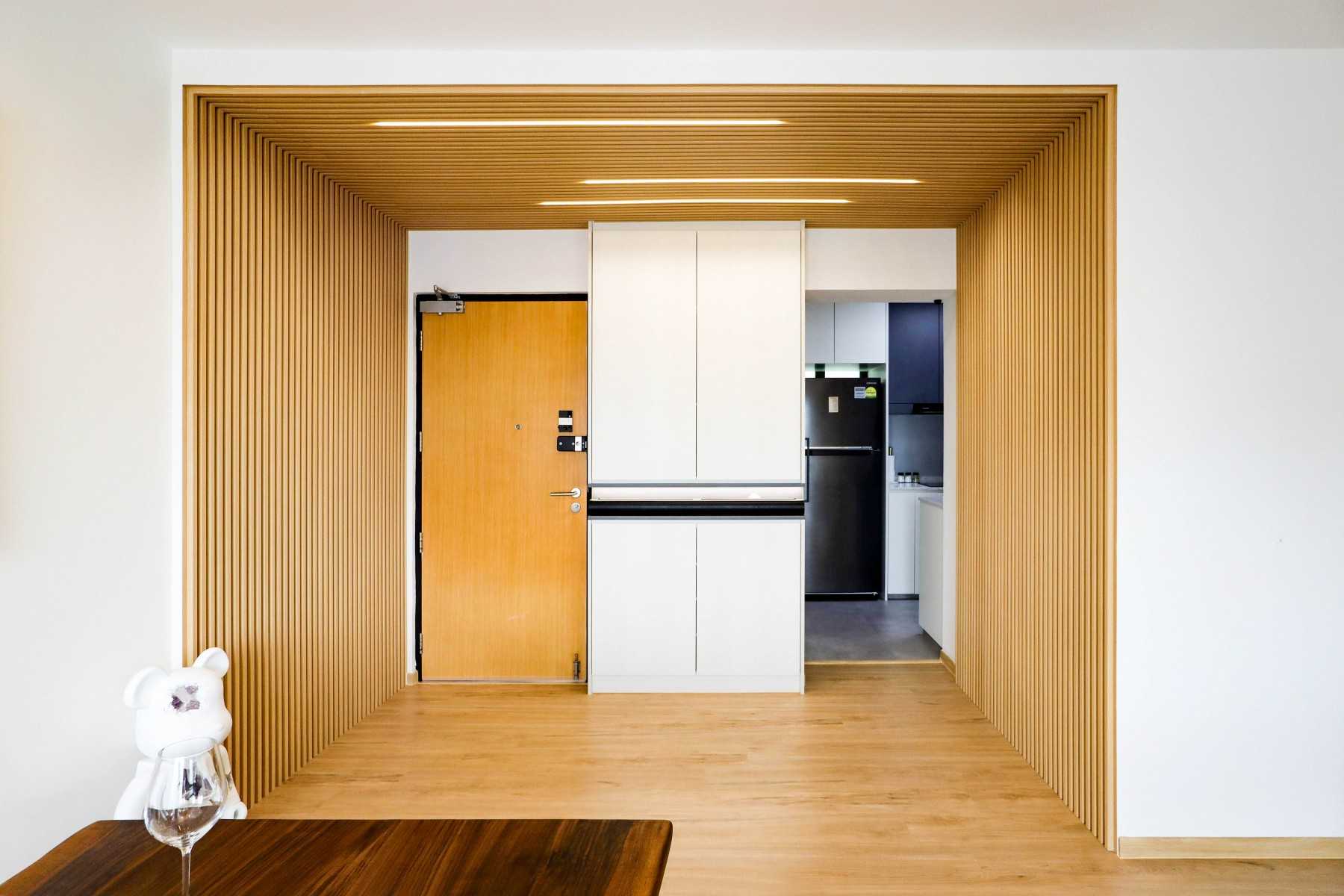 Scandinavian Entryway with Feature Wall and Storage Cabinets