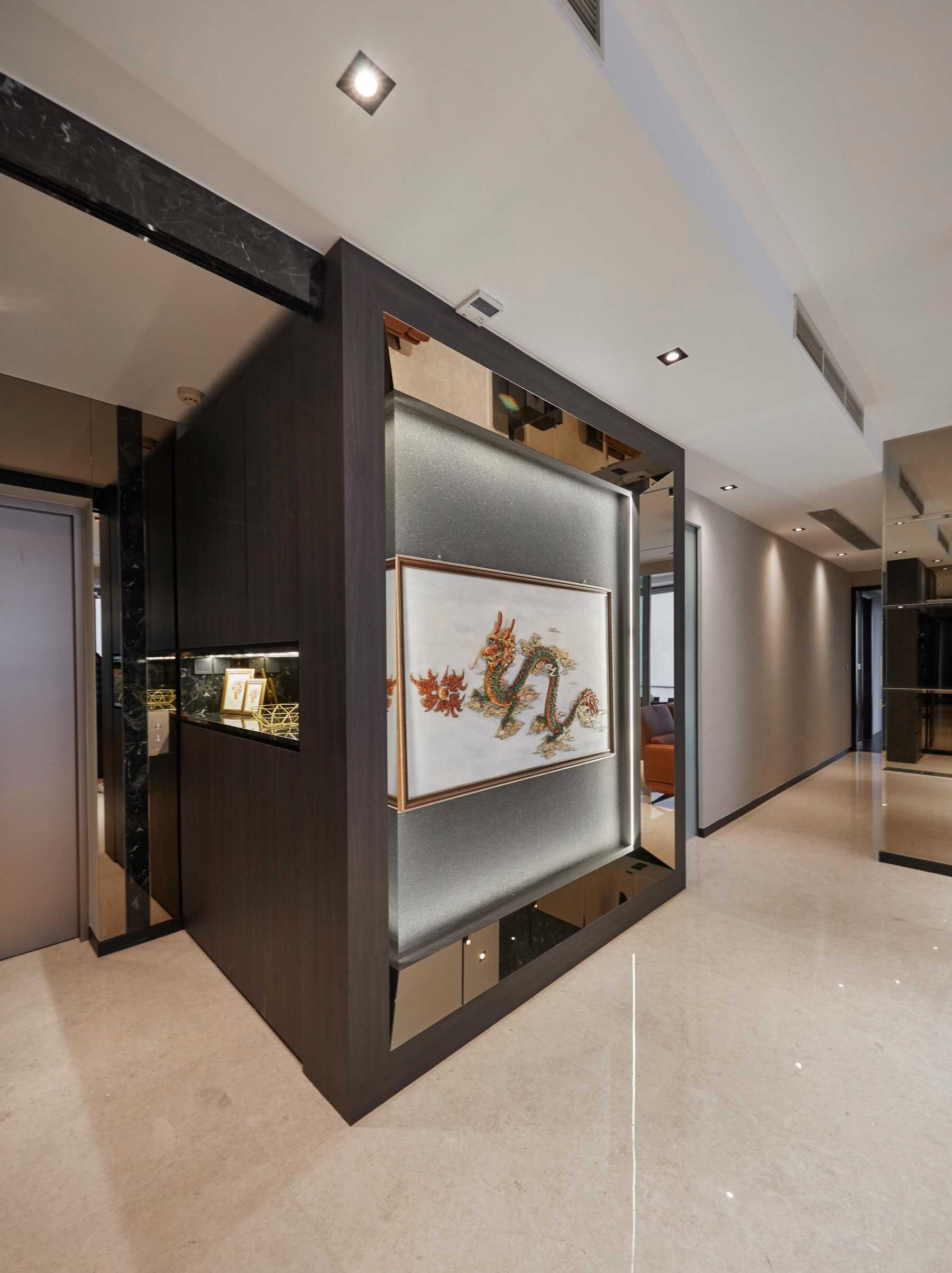 Modern Foyer with Paintings and Storage Cabinets