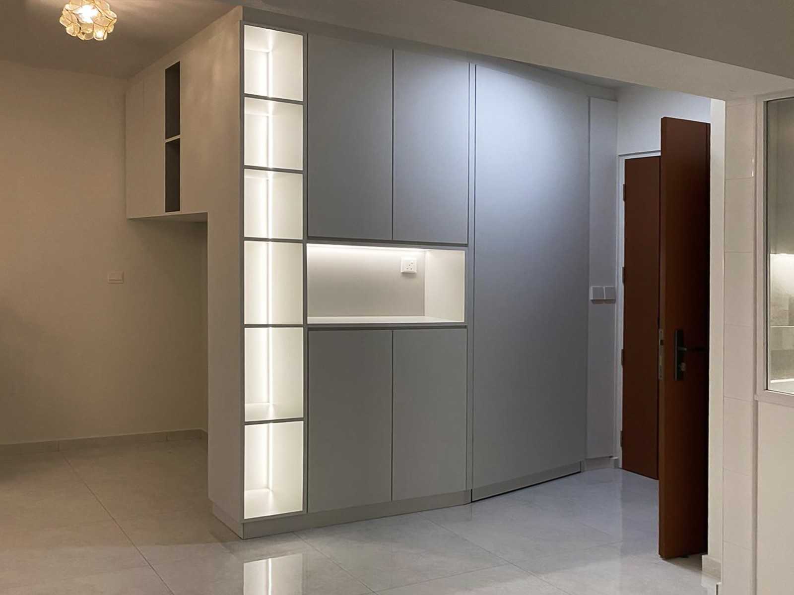 Scandinavian Foyer with Paintings and Storage Cabinets