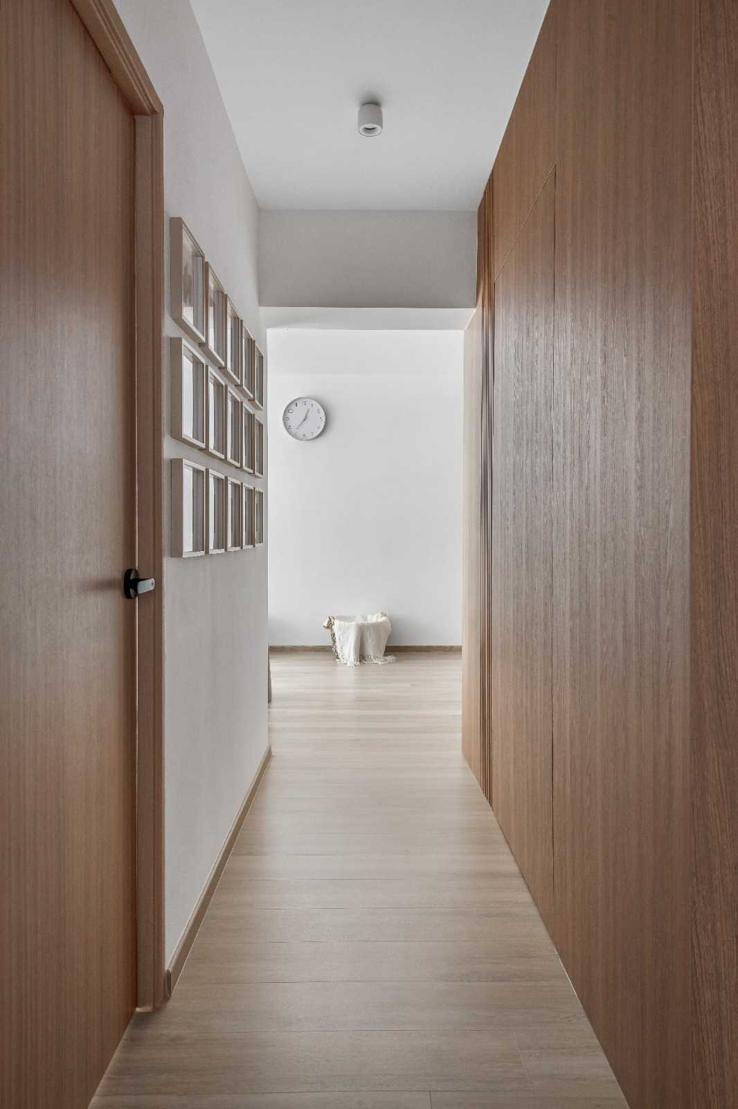 Scandinavian Hallway with Bookshelf and Artwork