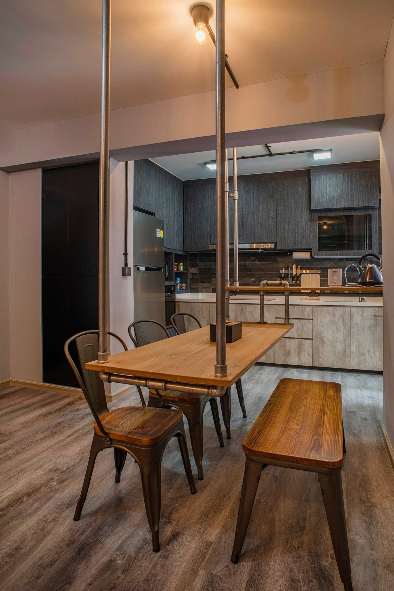 Industrial Dining Room with Drop Light and Dining Table